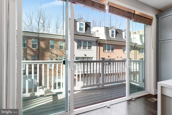 a view of a balcony and a floor to ceiling window