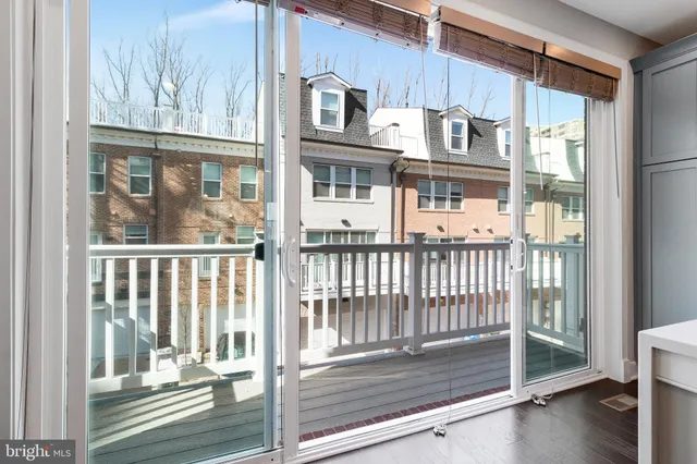 a view of a balcony and a floor to ceiling window