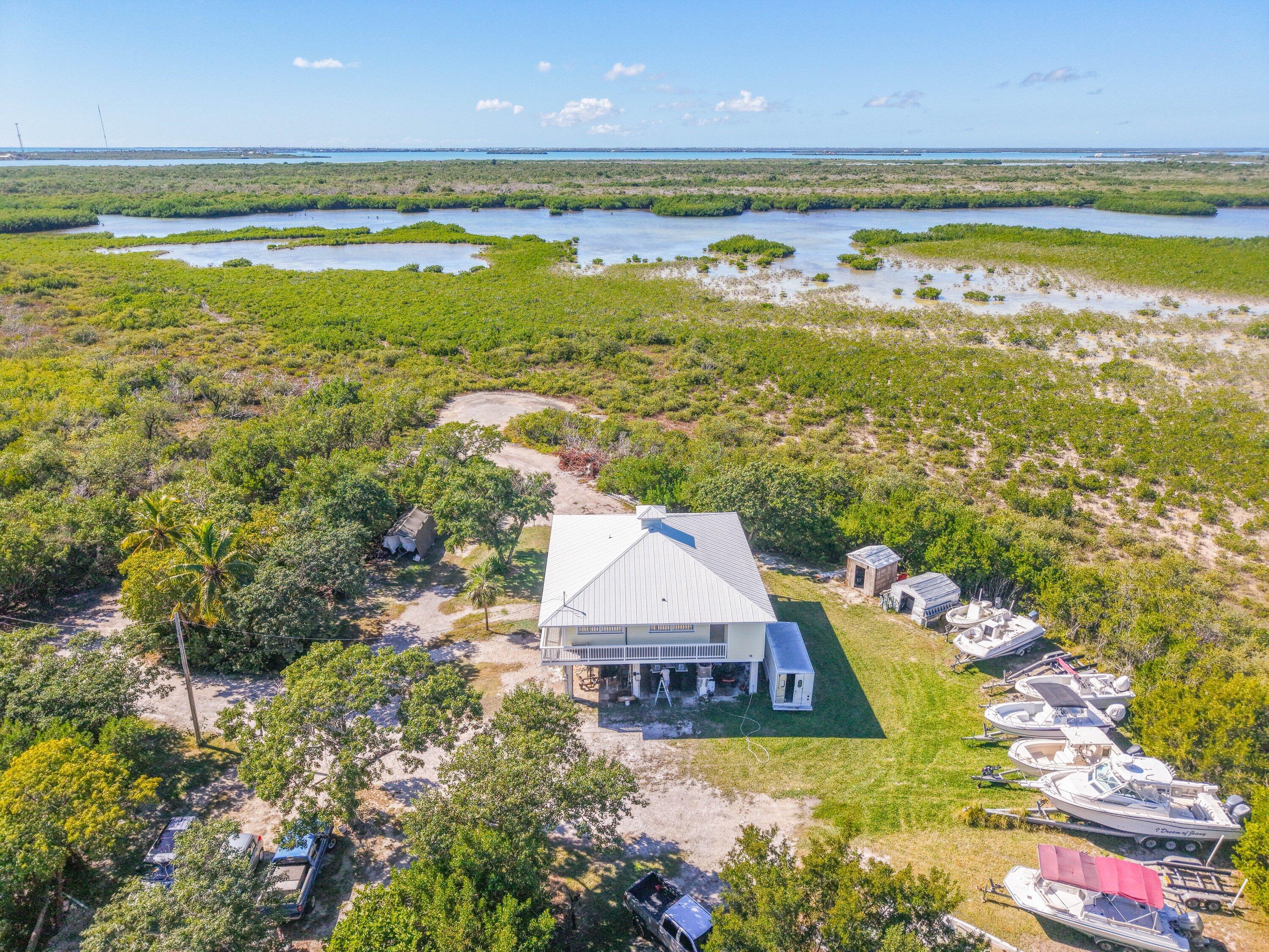 27821 Leeward S Road Summerland Key, FL 33042 - Photo 2 of 32 a view of an ocean and a building