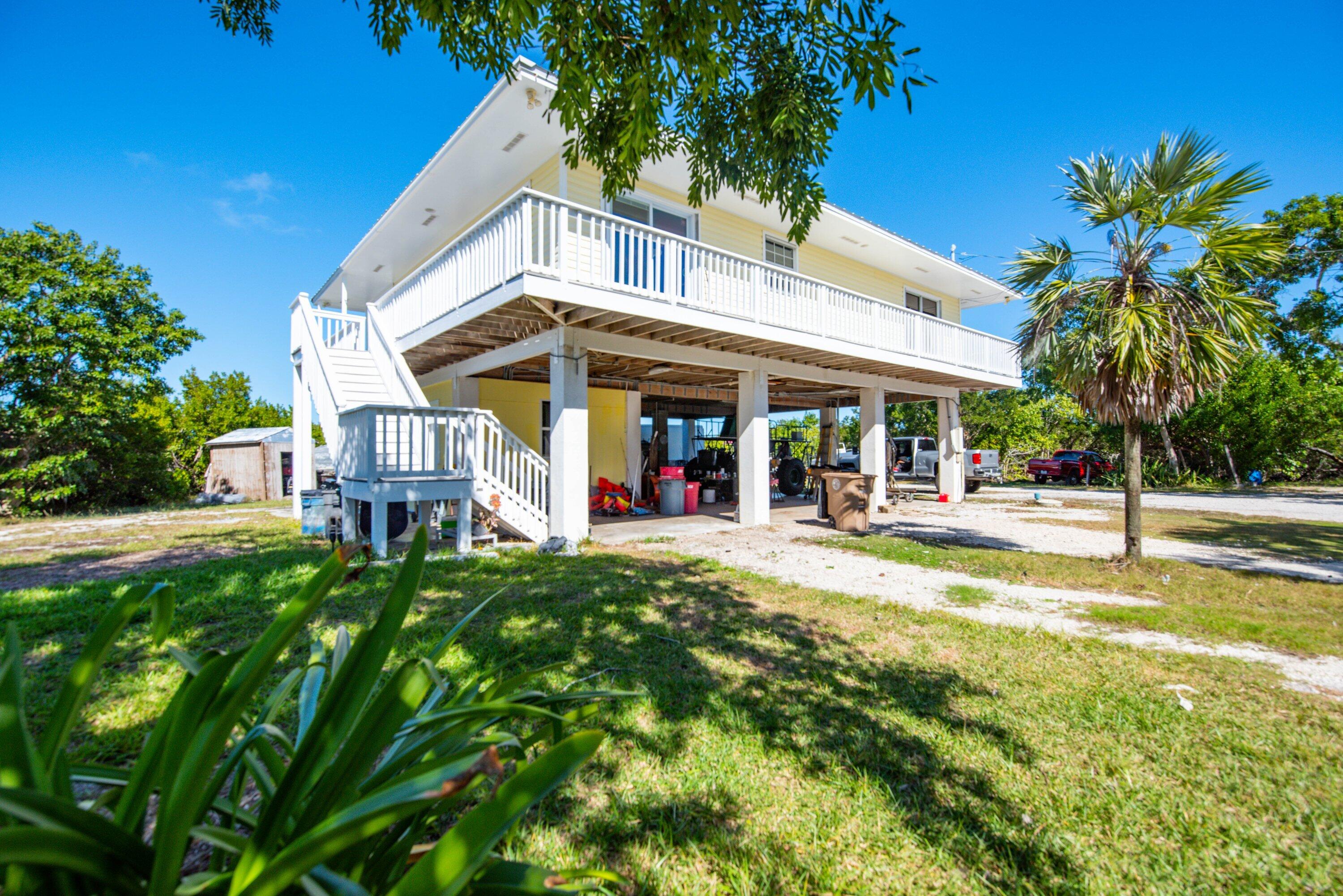 27821 Leeward S Road Summerland Key, FL 33042 - Photo 27 of 32 a view of a house with pool and sitting area