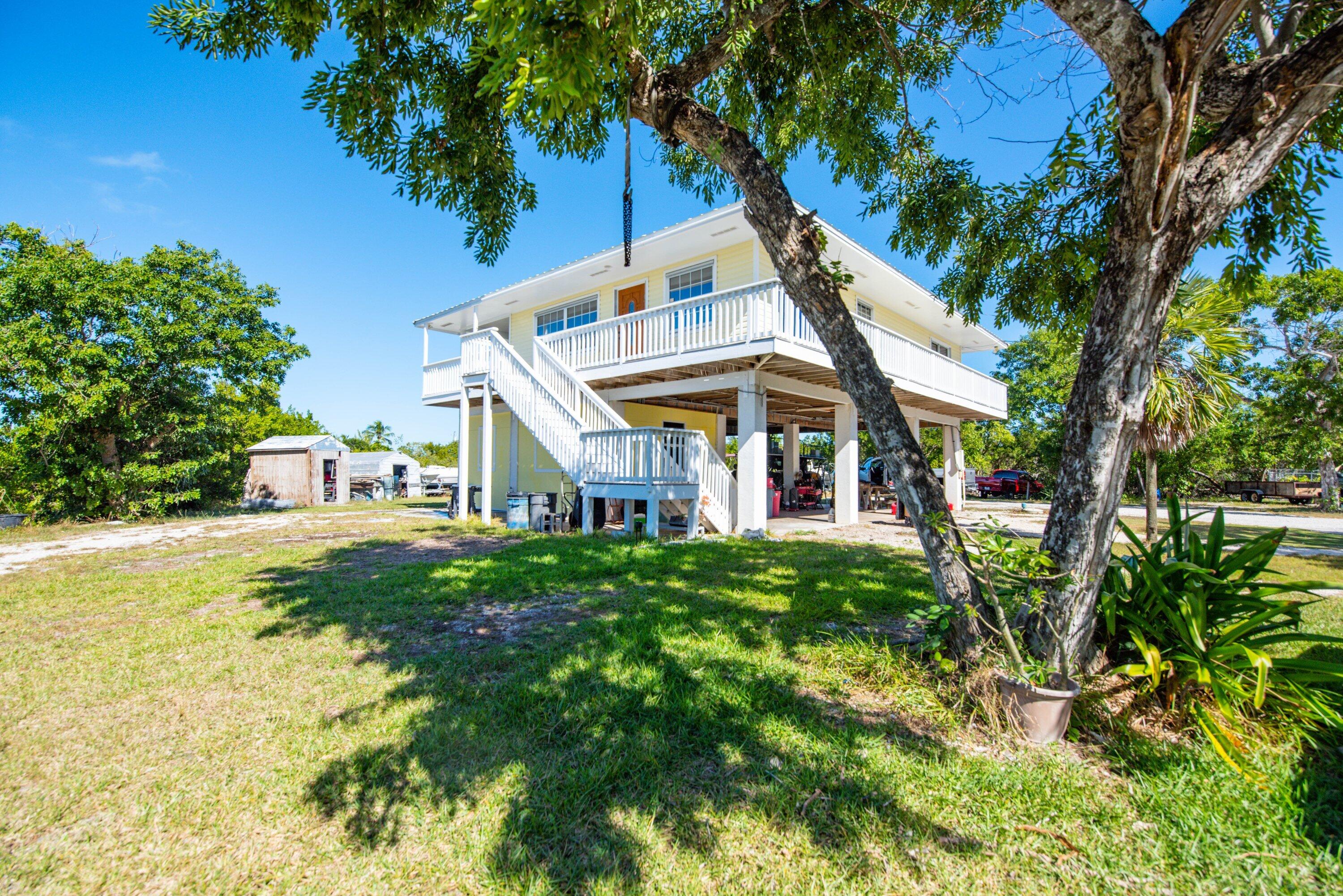 27821 Leeward S Road Summerland Key, FL 33042 - Photo 28 of 32 a view of a house with a yard