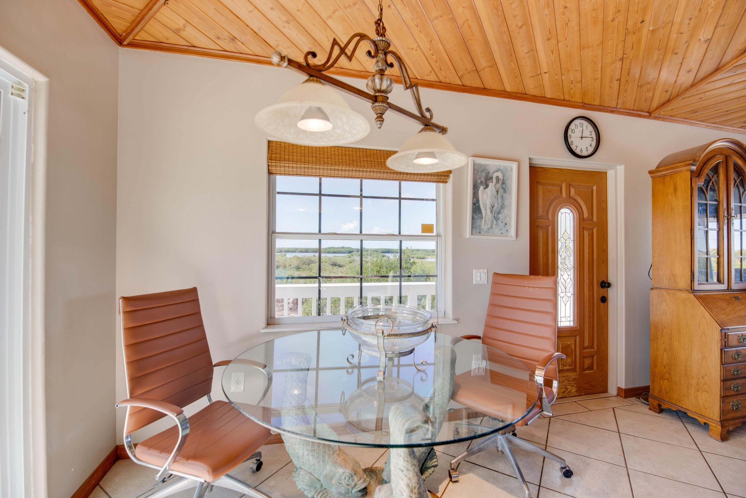 27821 Leeward S Road Summerland Key, FL 33042 - Photo 7 of 32 a view of a dining room with furniture window and outside view