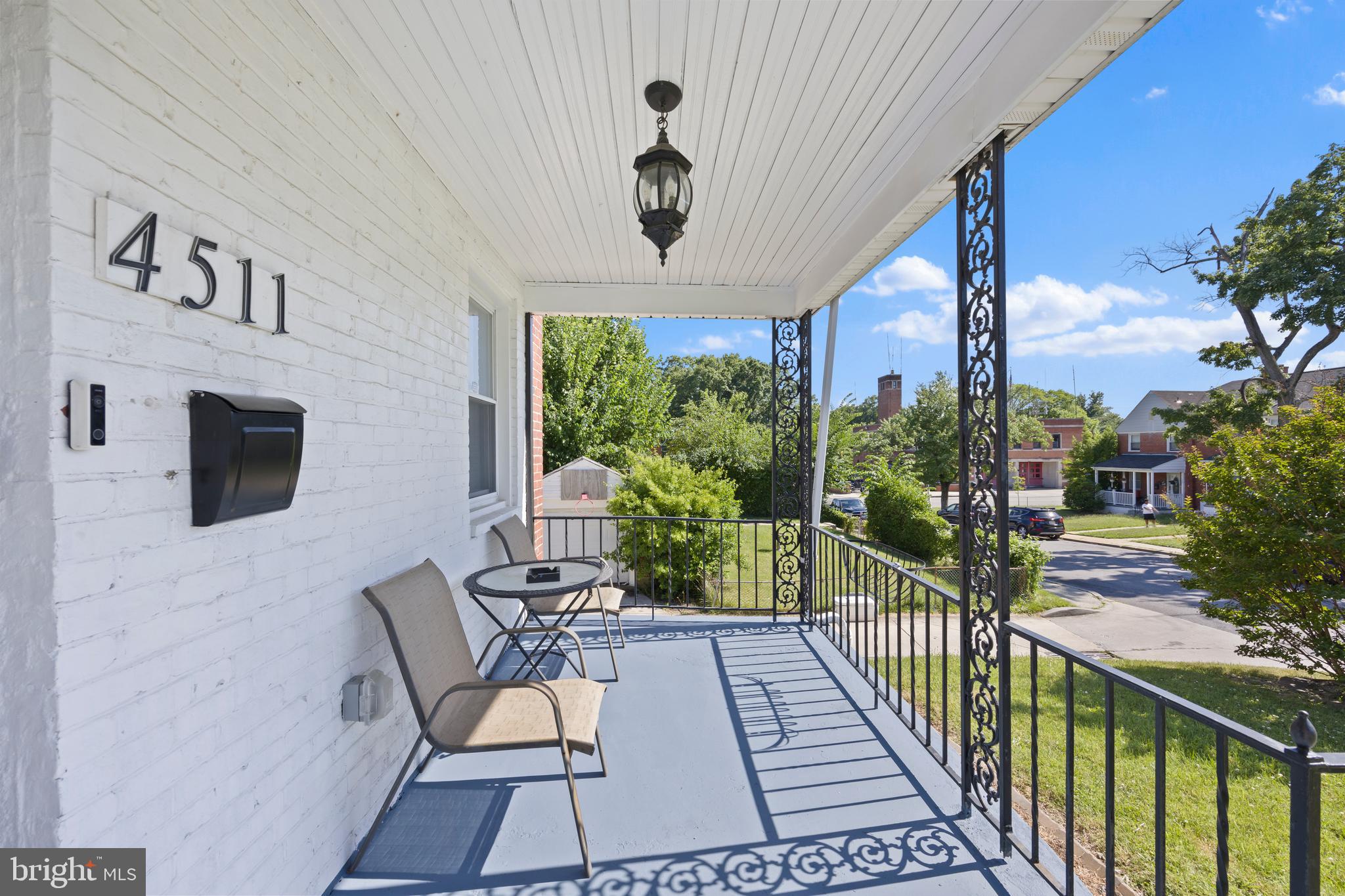 4511 Marble Hall Road Baltimore, MD 21239 - Photo 4 of 48 a view of a porch with furniture and a yard