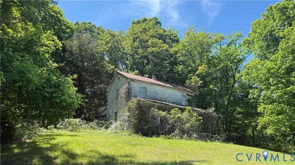 a backyard of a house with lots of green space