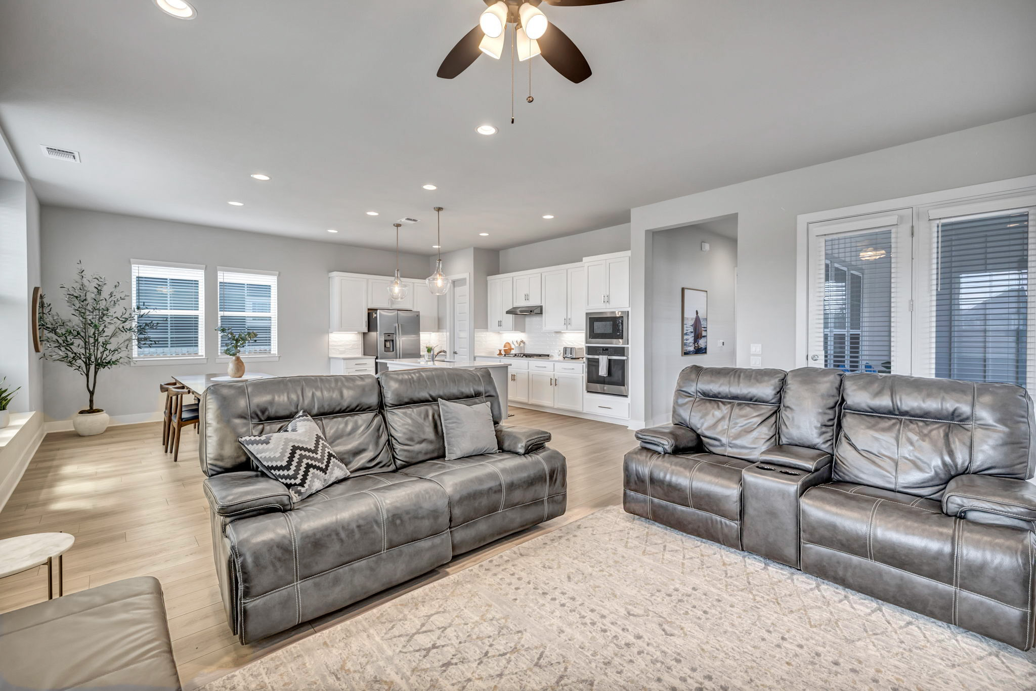 7808 Chrysler Bend Austin, TX 78744 - Photo 10 of 35 Generous living room adjacent to the covered patio allow for the perfect flow for indoor/outdoor living