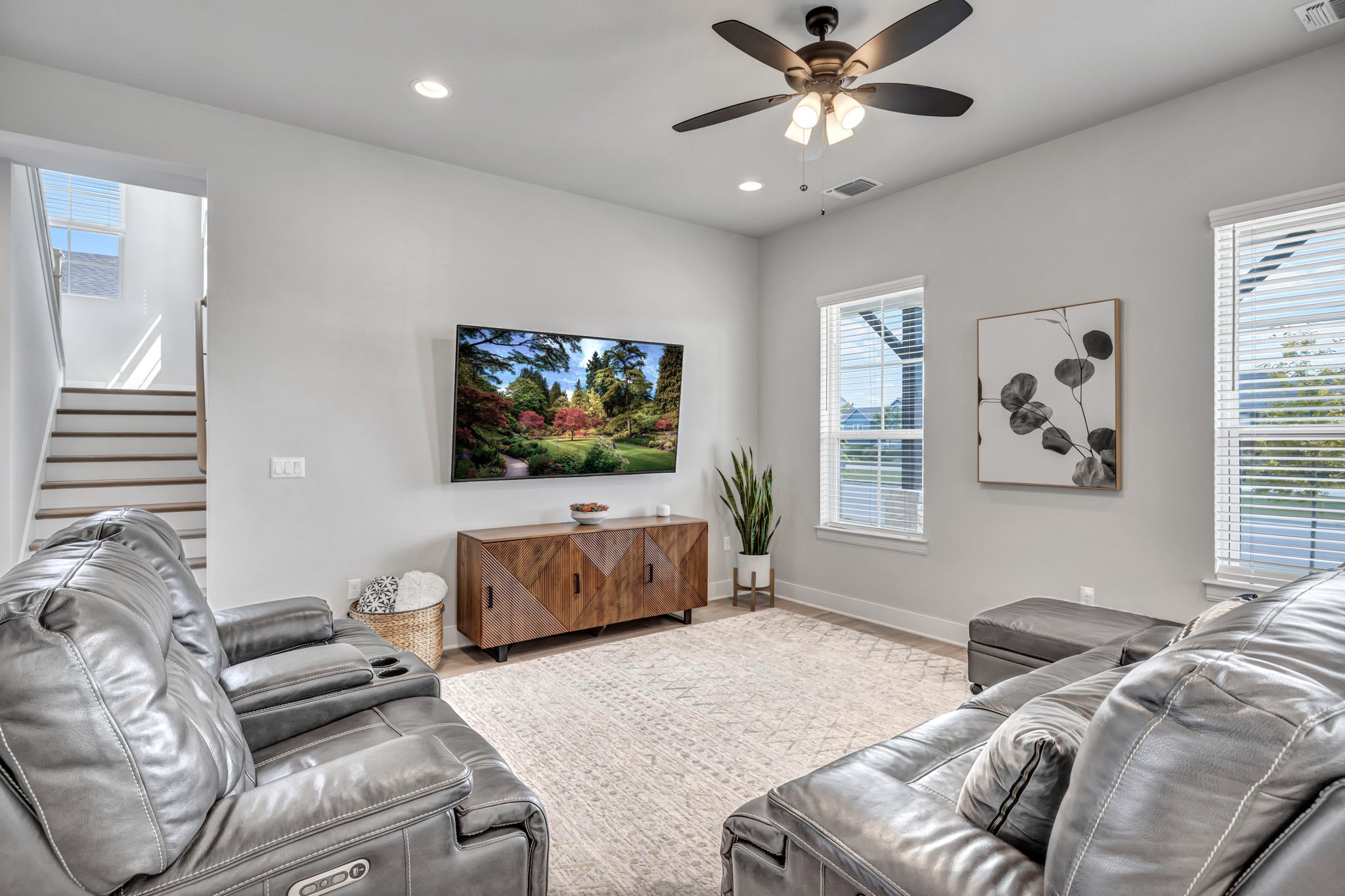 7808 Chrysler Bend Austin, TX 78744 - Photo 11 of 35 The 12 foot ceilings throughout the home create an elegant feel. Spacious living area with ceiling fan and recessed lighting