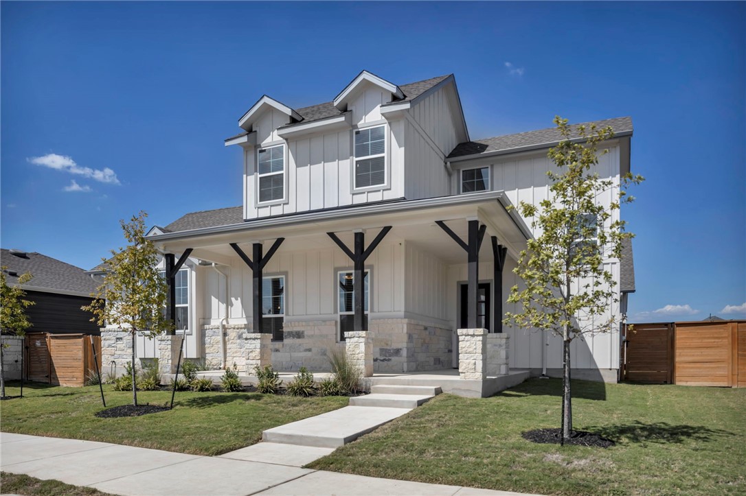 7808 Chrysler Bend Austin, TX 78744 - Photo 2 of 35 Beautiful Austin stone facade and board and batten siding with the modern look that Easton Park is known for.