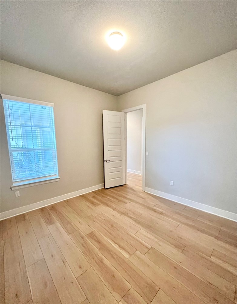 7808 Chrysler Bend Austin, TX 78744 - Photo 22 of 35 Separate, designated office with 12 foot ceilings on the main-level, in addition to the 4 bedrooms