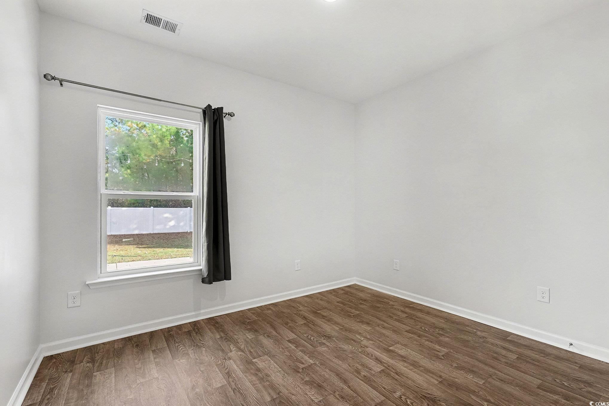 197 Springtide Drive Conway, SC 29527 - Photo 12 of 21 Spare room featuring dark wood-type flooring and ceiling fan