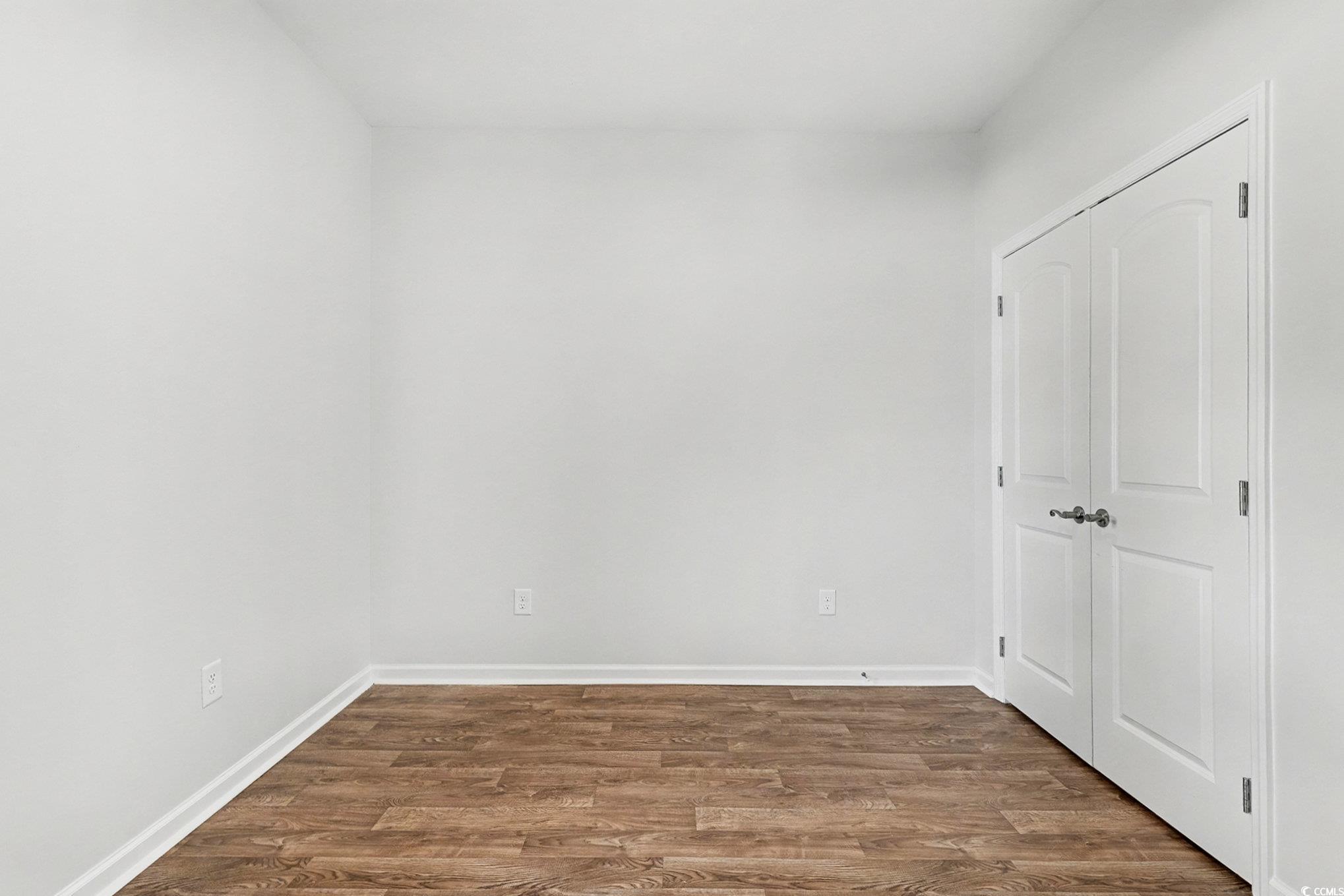 197 Springtide Drive Conway, SC 29527 - Photo 13 of 21 Unfurnished room featuring dark wood-style flooring and baseboards