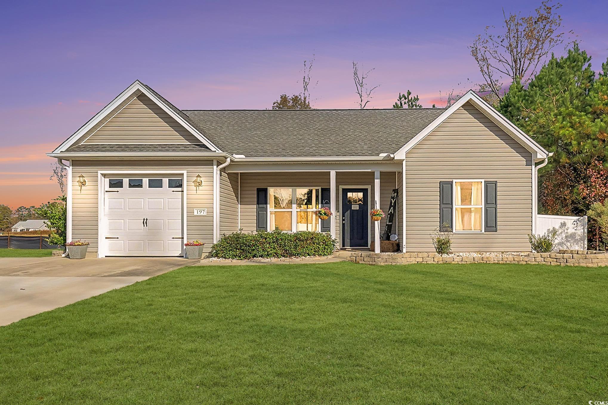 197 Springtide Drive Conway, SC 29527 - Photo 19 of 21 Virtually Enhanced Grass. Rear view of house with a fenced backyard and a patio area