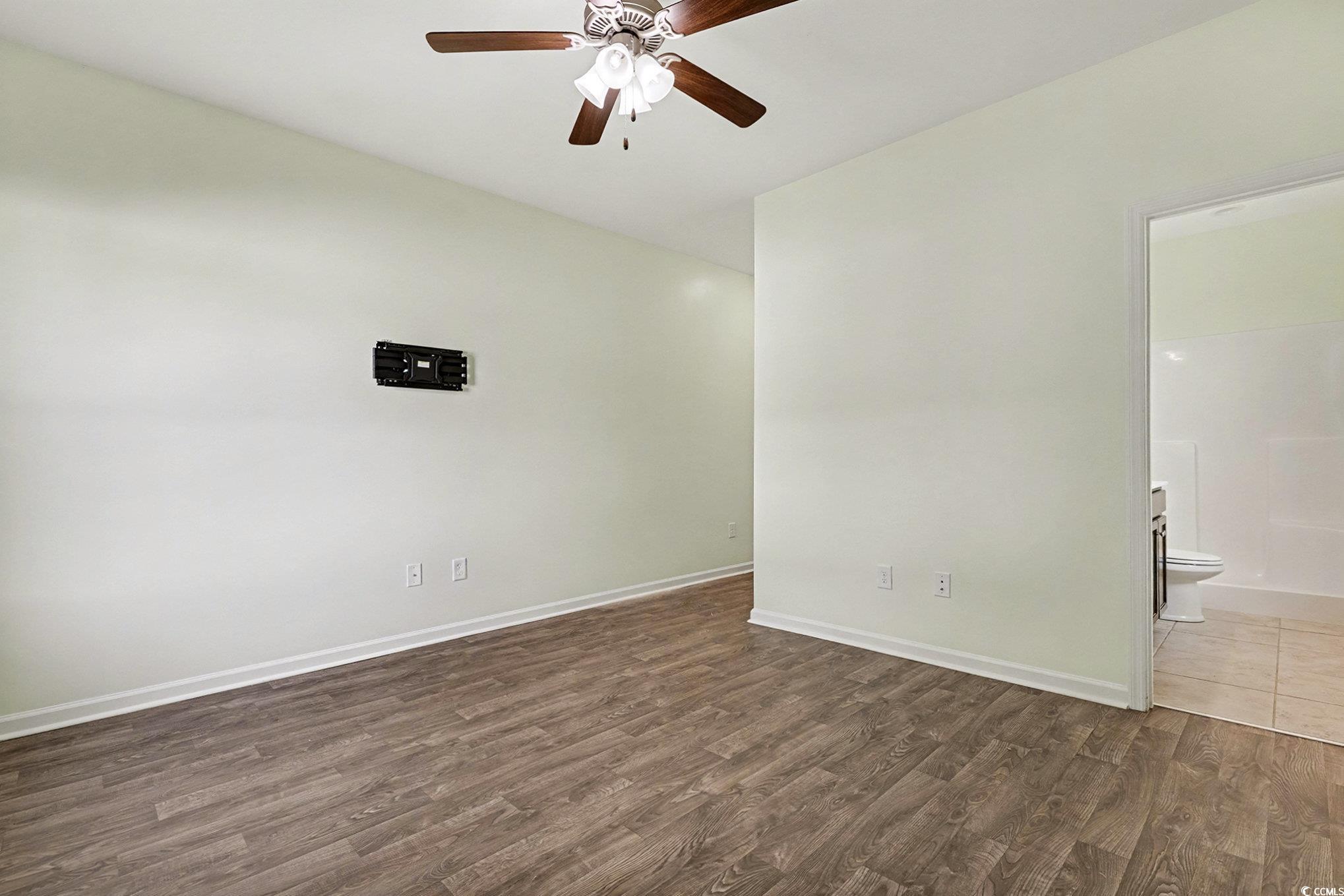197 Springtide Drive Conway, SC 29527 - Photo 6 of 21 Kitchen with stainless steel appliances, dark brown cabinetry, pendant lighting, a peninsula, and light tile patterned floors