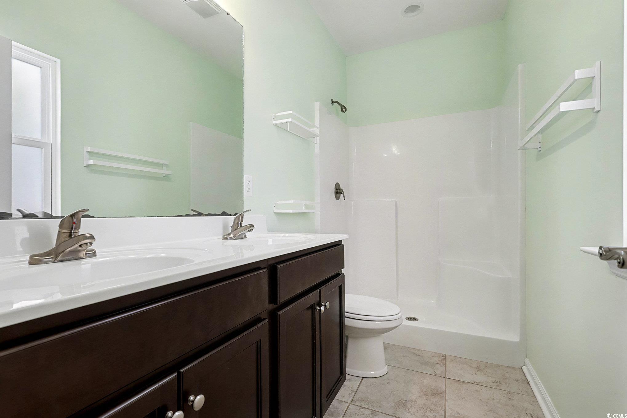197 Springtide Drive Conway, SC 29527 - Photo 7 of 21 Empty room featuring dark wood finished floors and a ceiling fan