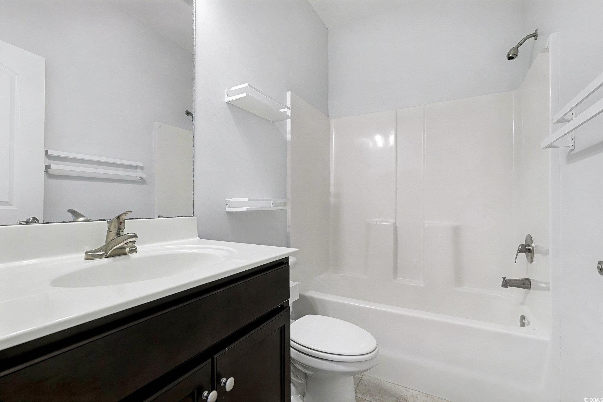 197 Springtide Drive Conway, SC 29527 - Photo 10 of 21 Unfurnished bedroom featuring dark wood finished floors and a closet