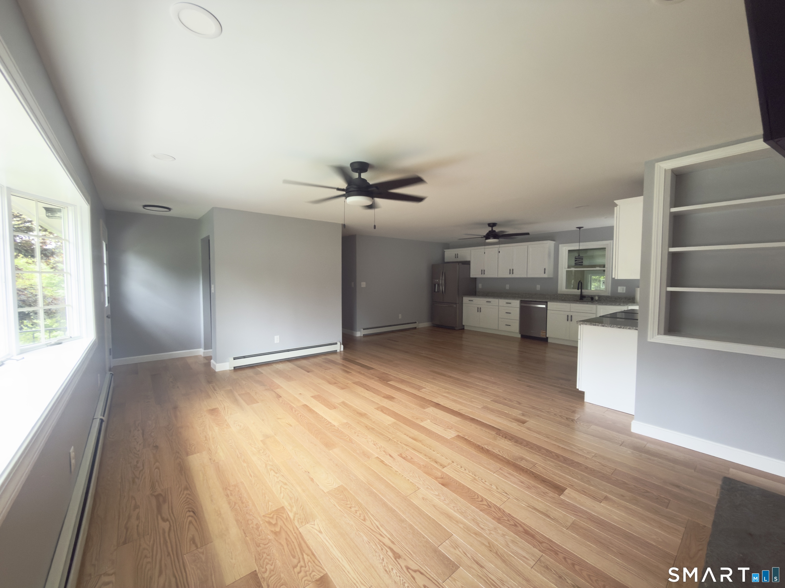 44 Polly Avenue Killingly, CT 06239 - Photo 14 of 22 wooden floor in an empty room with a window