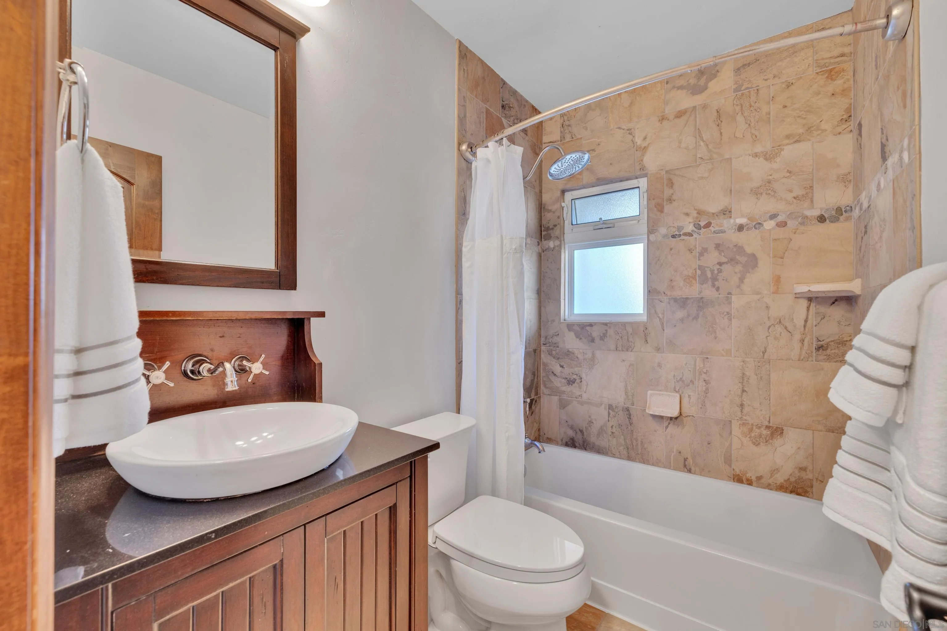 16548 Espola Road Poway, CA 92064 - Photo 24 of 70 a bathroom with a granite countertop toilet a sink and a bathtub