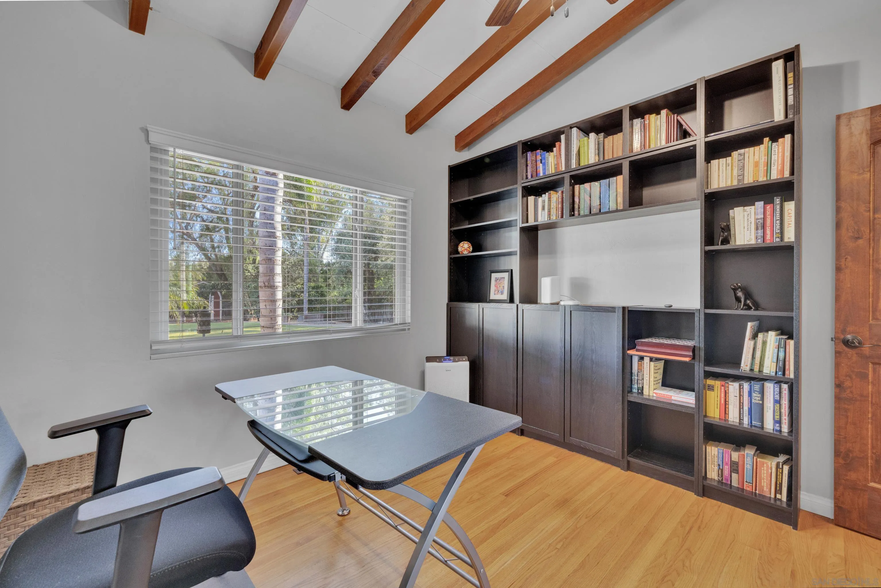 16548 Espola Road Poway, CA 92064 - Photo 26 of 70 a bedroom with furniture and a book shelf