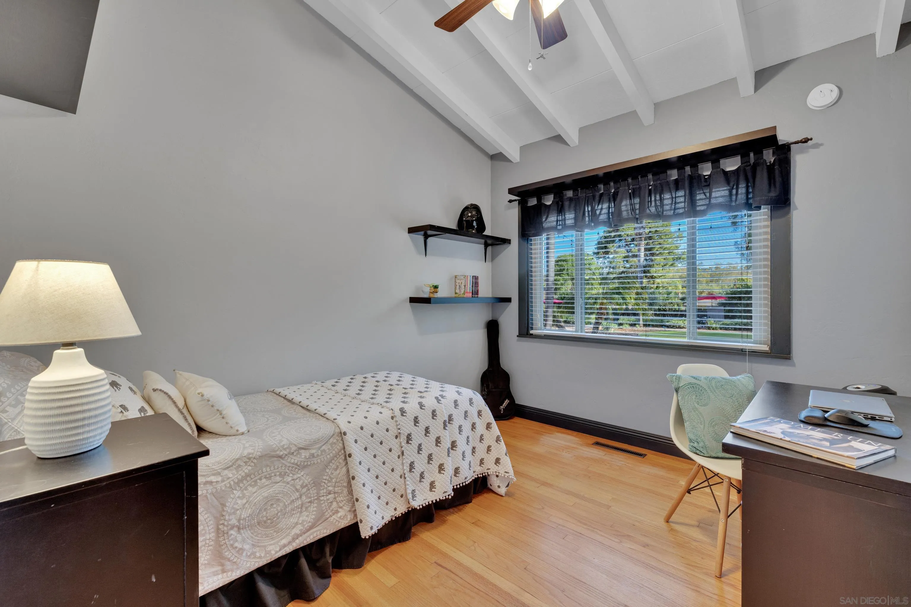 16548 Espola Road Poway, CA 92064 - Photo 28 of 70 a bedroom with a bed and a lamp on dresser