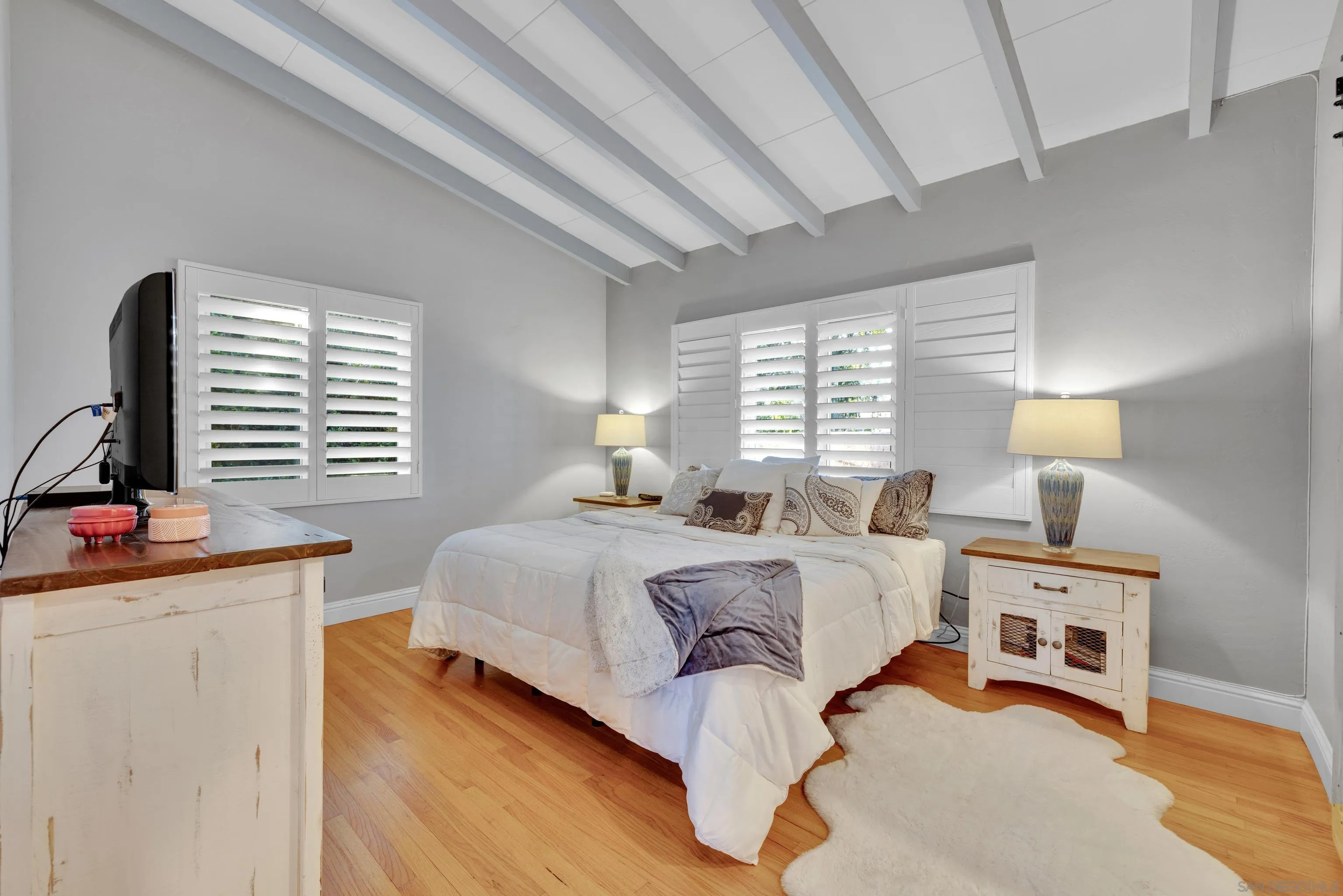 16548 Espola Road Poway, CA 92064 - Photo 30 of 70 a bedroom with a bed and a window