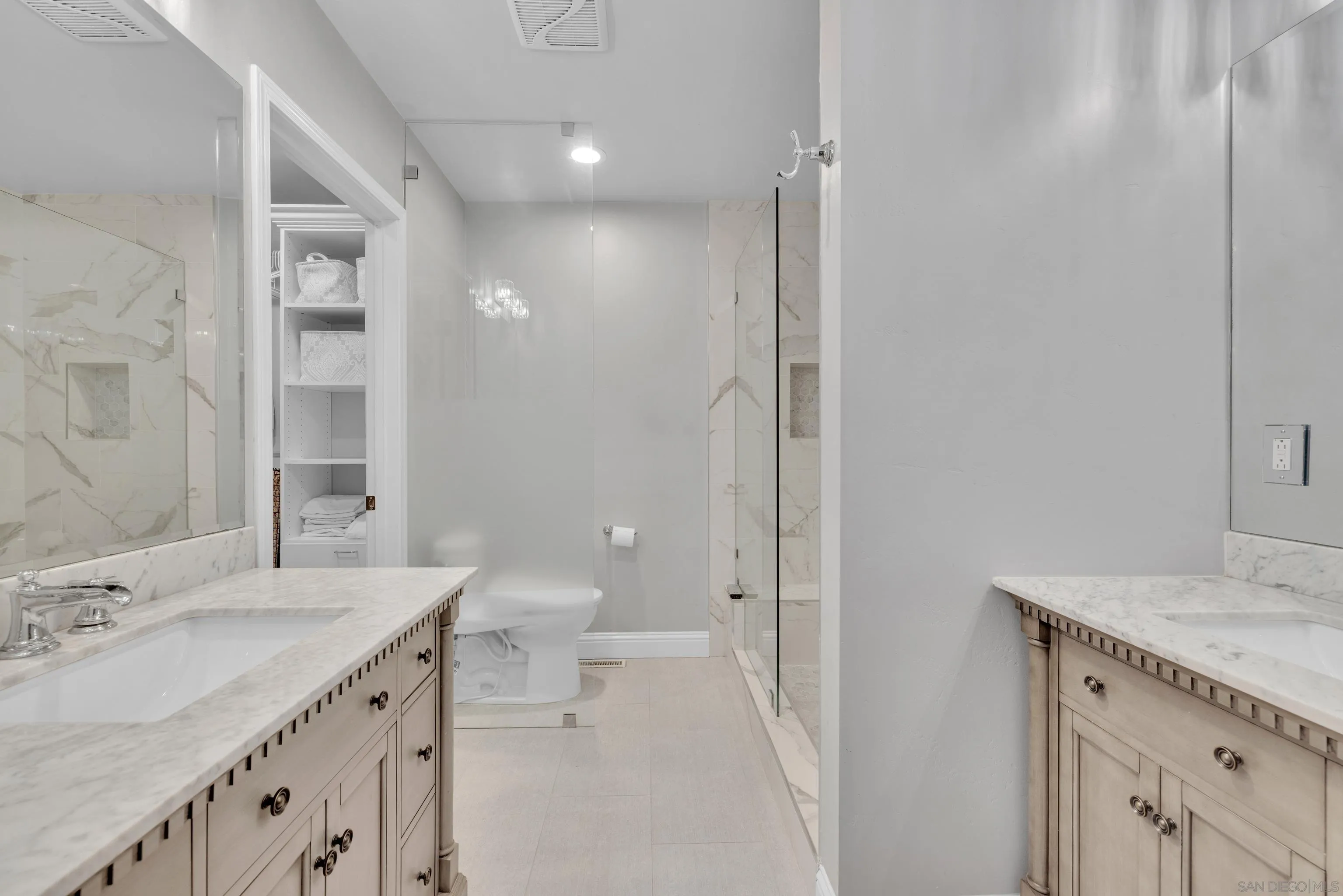 16548 Espola Road Poway, CA 92064 - Photo 33 of 70 a bathroom with a sink a toilet and shower