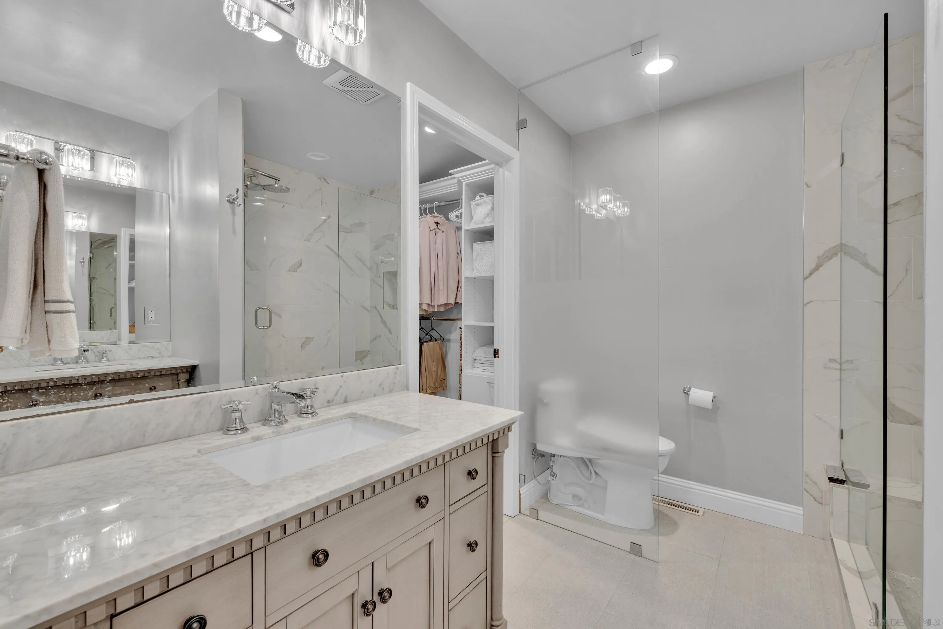 16548 Espola Road Poway, CA 92064 - Photo 34 of 70 a bathroom with a granite countertop sink a toilet and shower