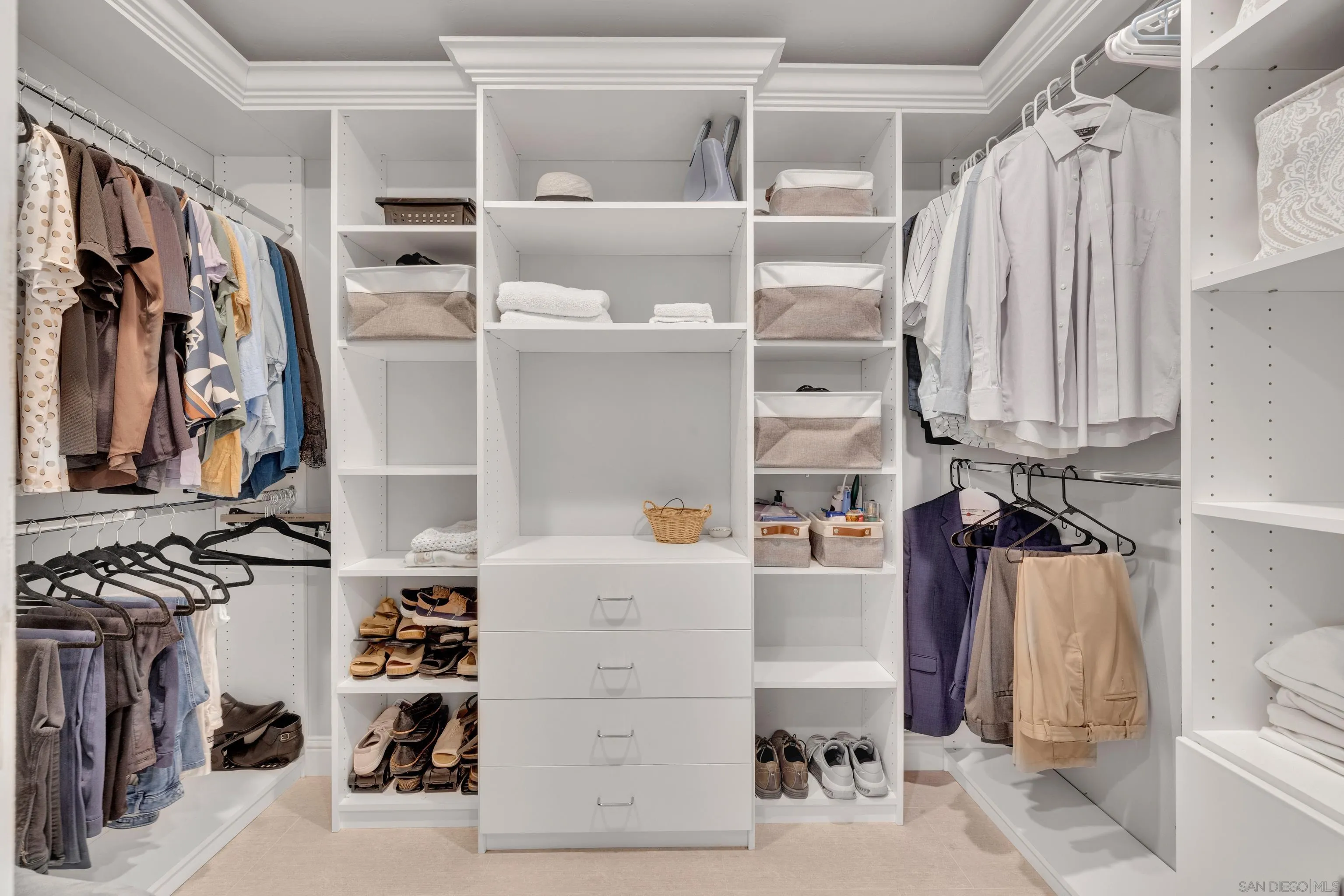 16548 Espola Road Poway, CA 92064 - Photo 35 of 70 a view of walk in closet with clothes and shoes