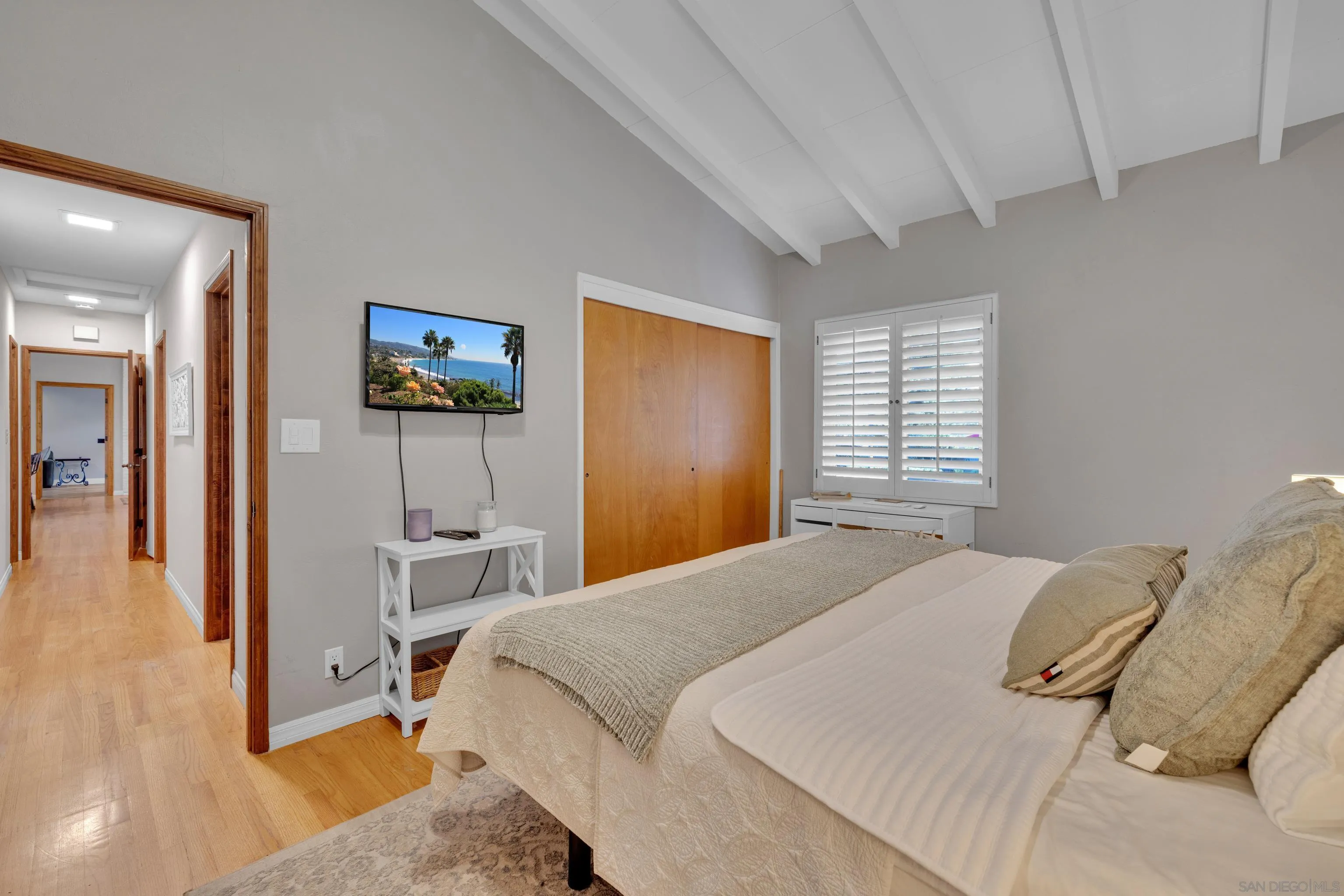 16548 Espola Road Poway, CA 92064 - Photo 38 of 70 a bedroom with a bed and a painting on the wall
