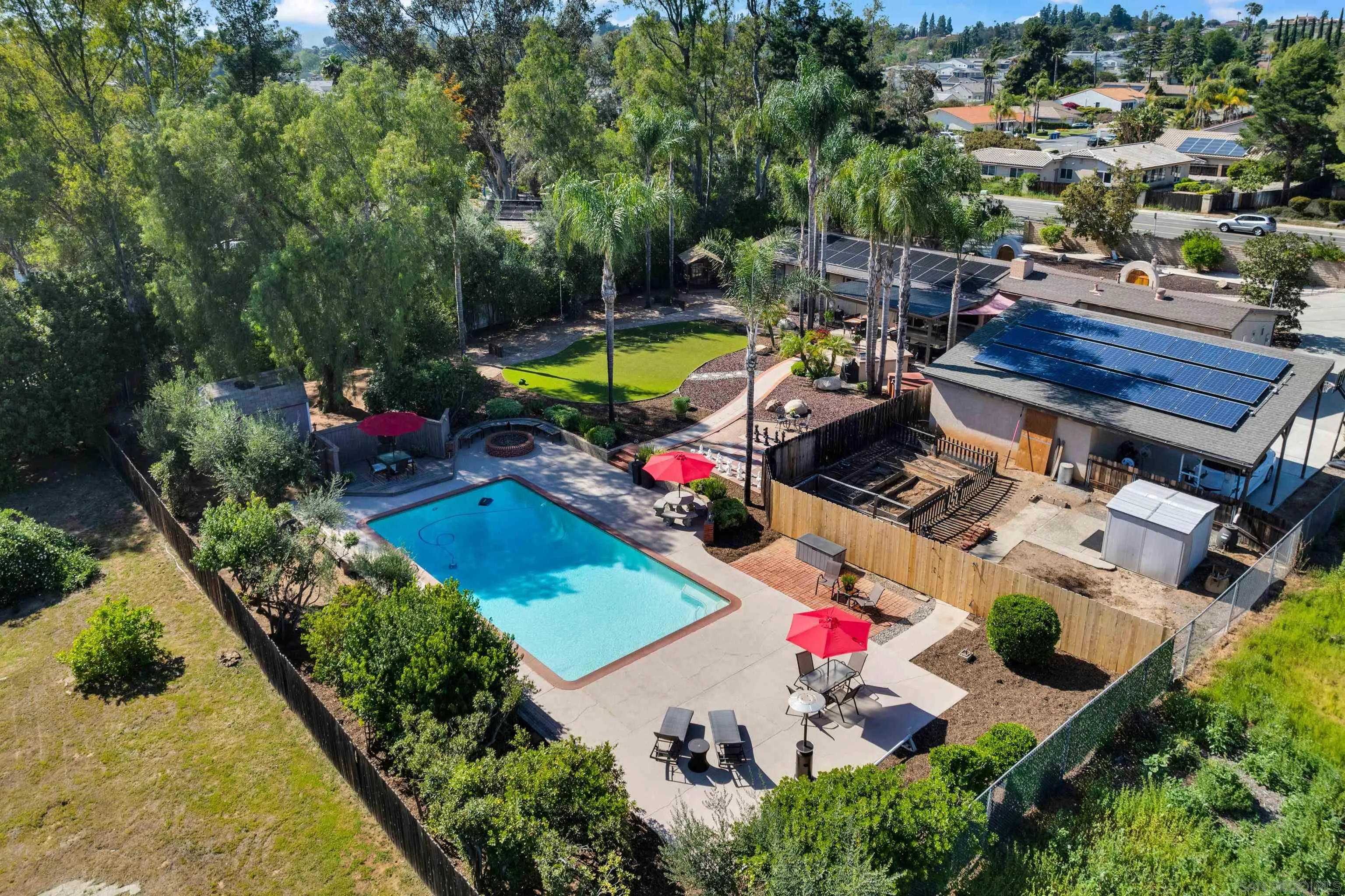 16548 Espola Road Poway, CA 92064 - Photo 45 of 70 an aerial view of a house with a garden and swimming pool