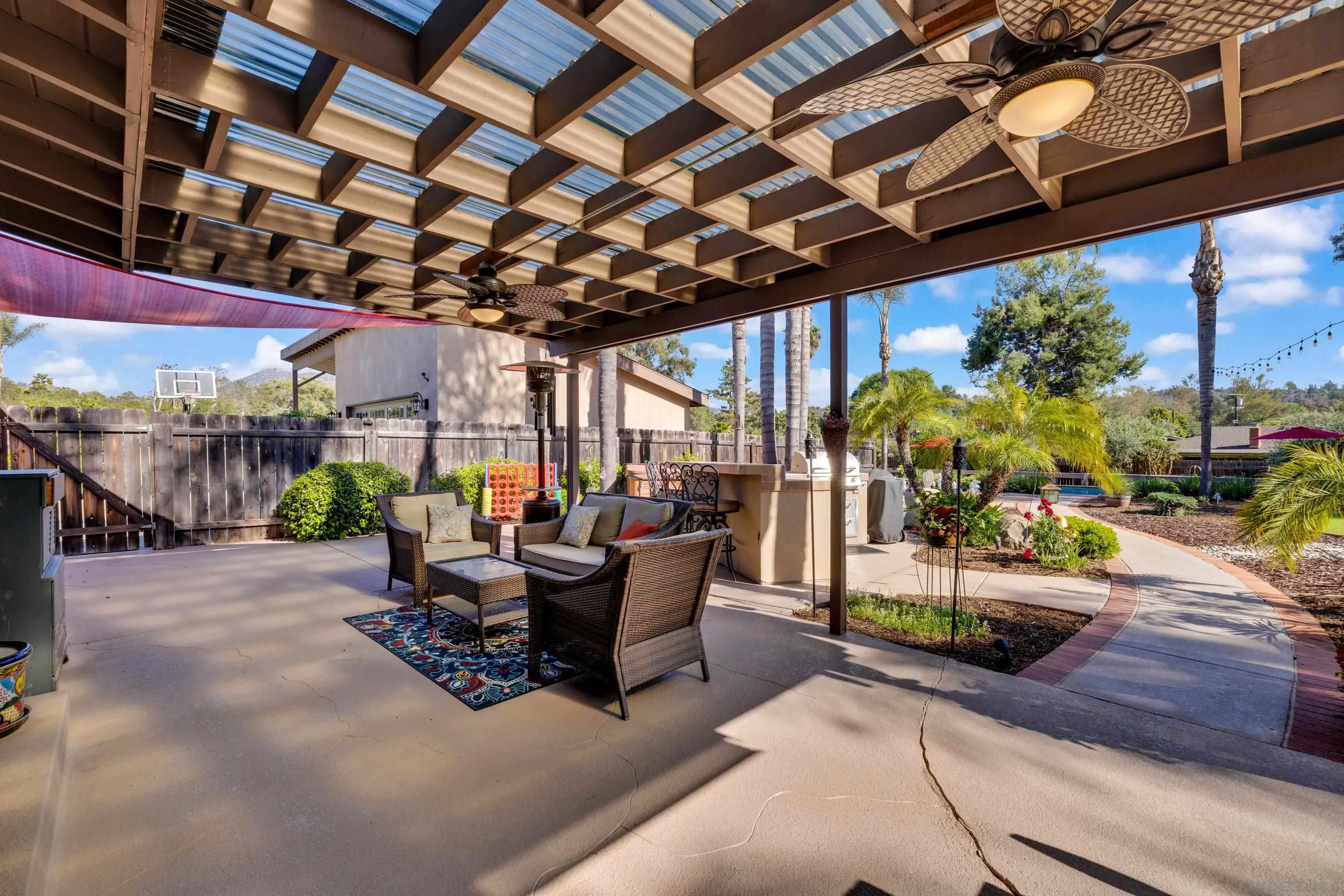 16548 Espola Road Poway, CA 92064 - Photo 48 of 70 a view of a patio with table and chairs potted plants