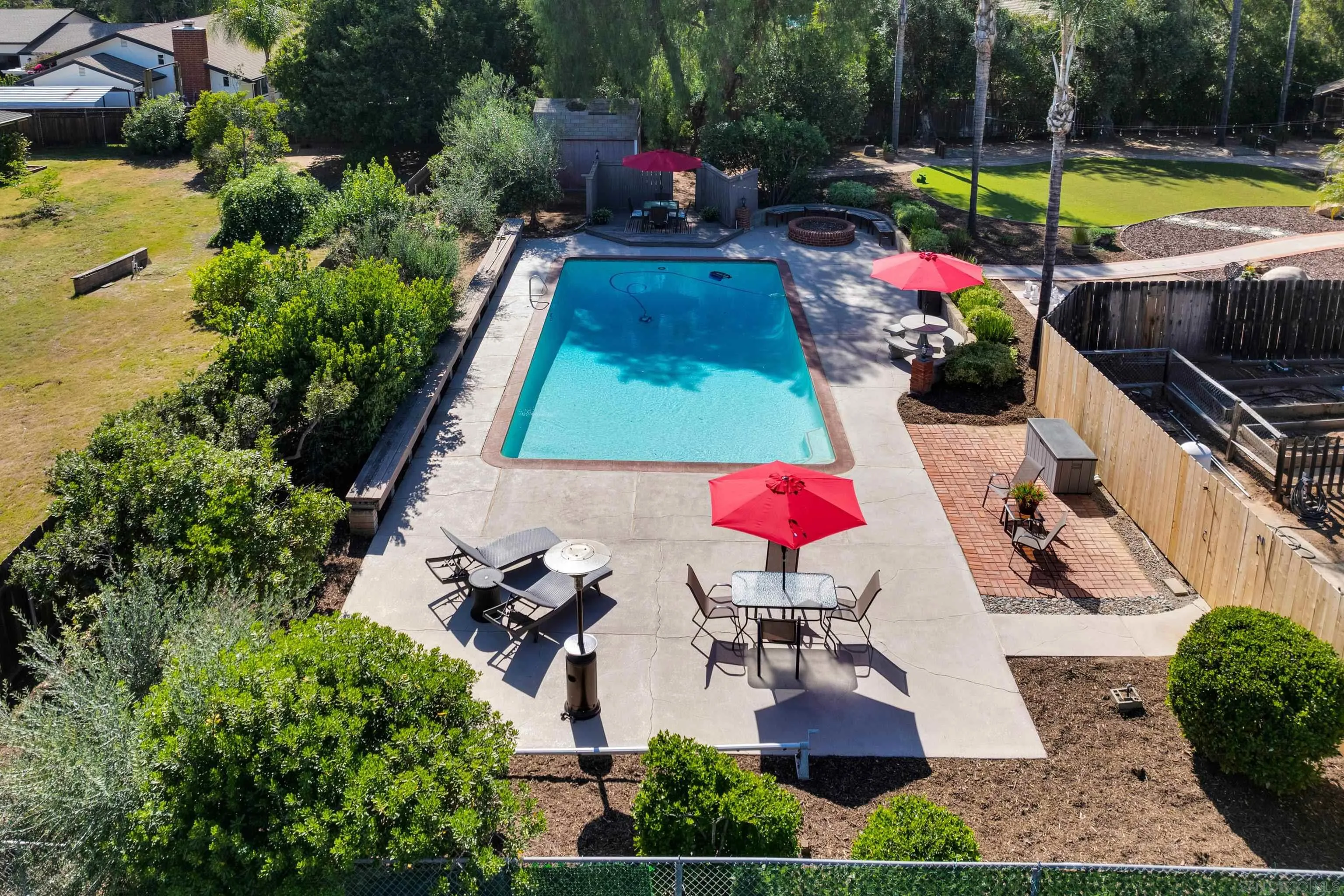 16548 Espola Road Poway, CA 92064 - Photo 51 of 70 an aerial view of a house with swimming pool and large trees