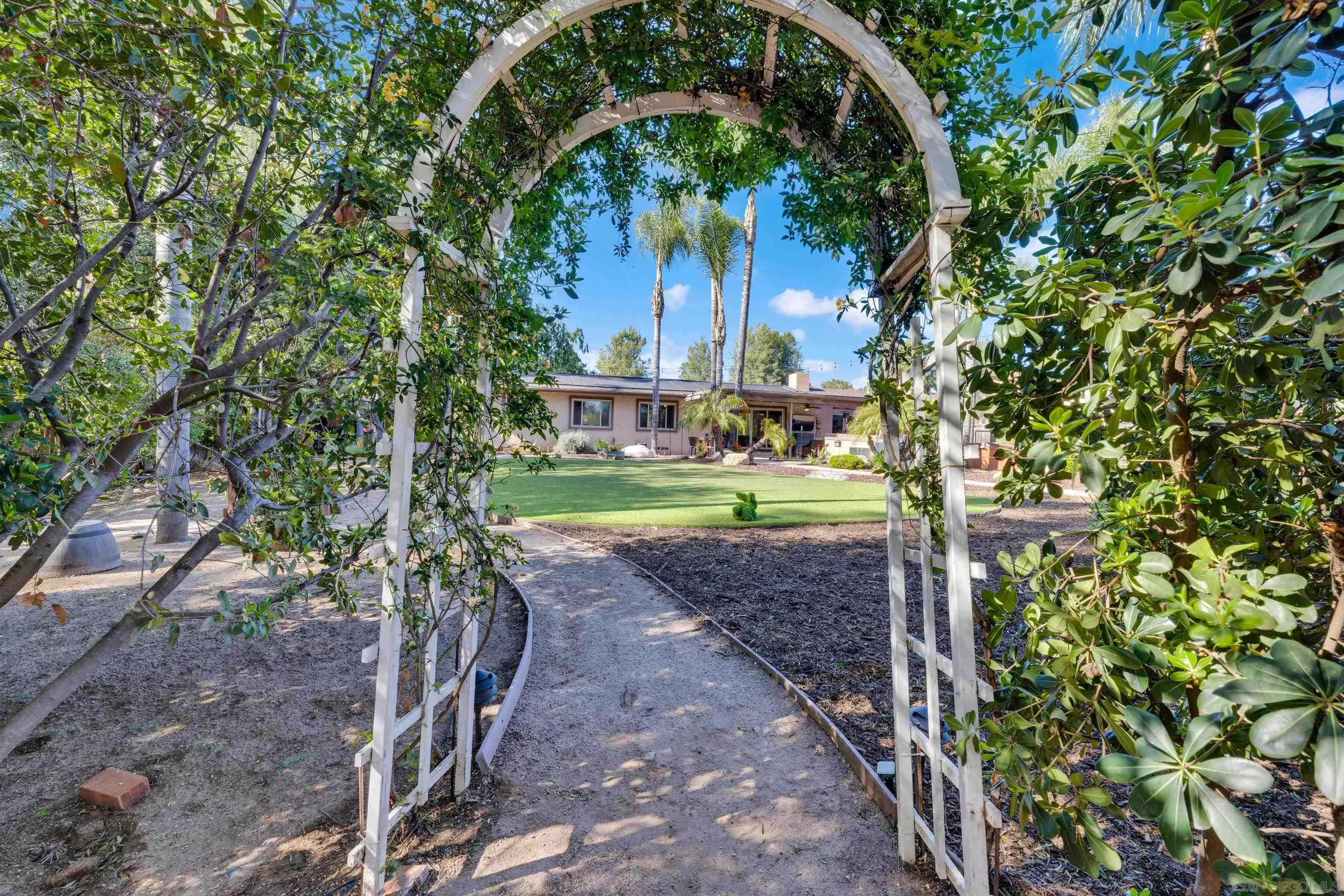 16548 Espola Road Poway, CA 92064 - Photo 55 of 70 a view of a yard with plants and trees