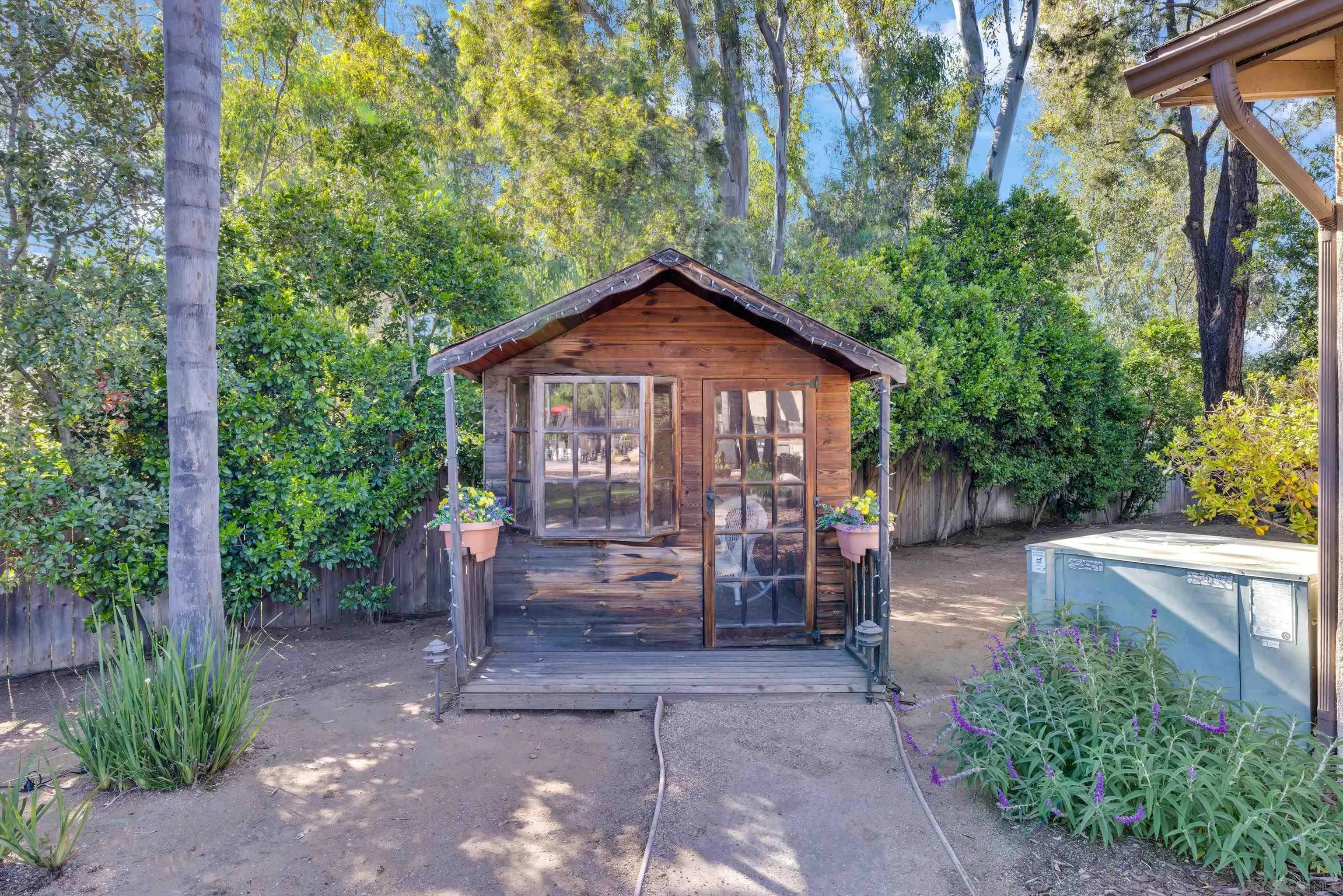 16548 Espola Road Poway, CA 92064 - Photo 57 of 70 a front view of a house with a garden