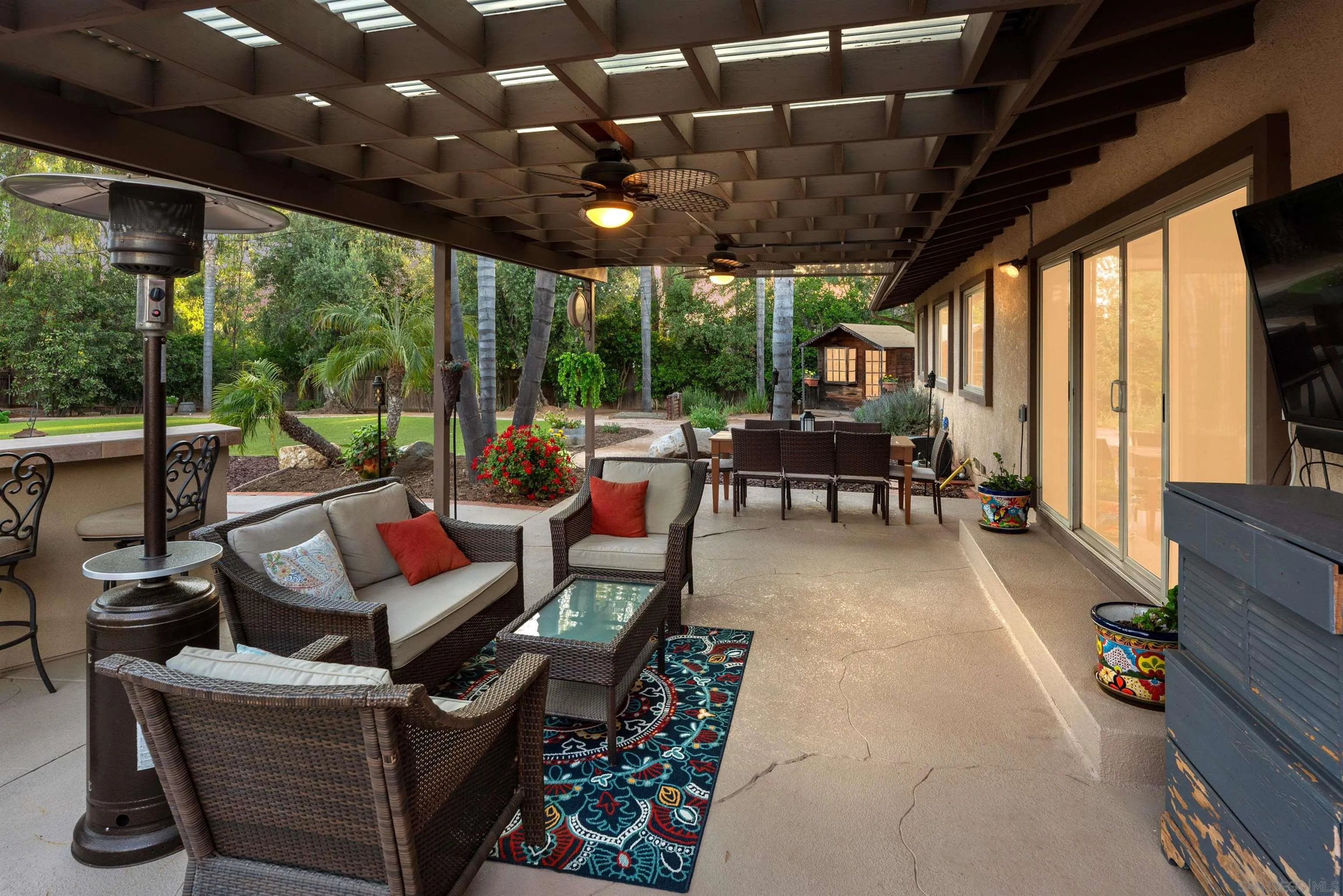 16548 Espola Road Poway, CA 92064 - Photo 64 of 70 a living room with patio furniture and a floor to ceiling window