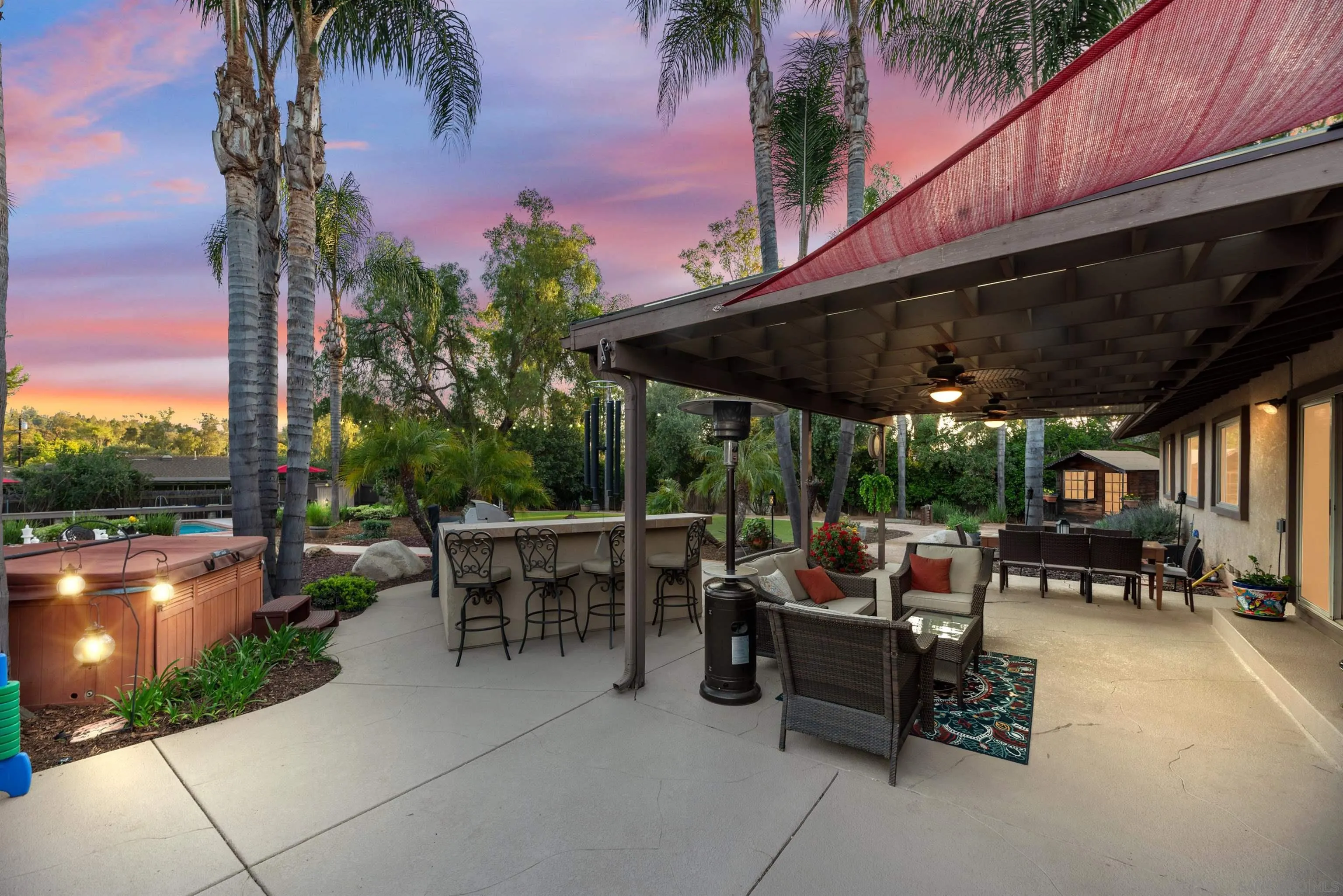 16548 Espola Road Poway, CA 92064 - Photo 65 of 70 a patio with a table and chairs and potted plants