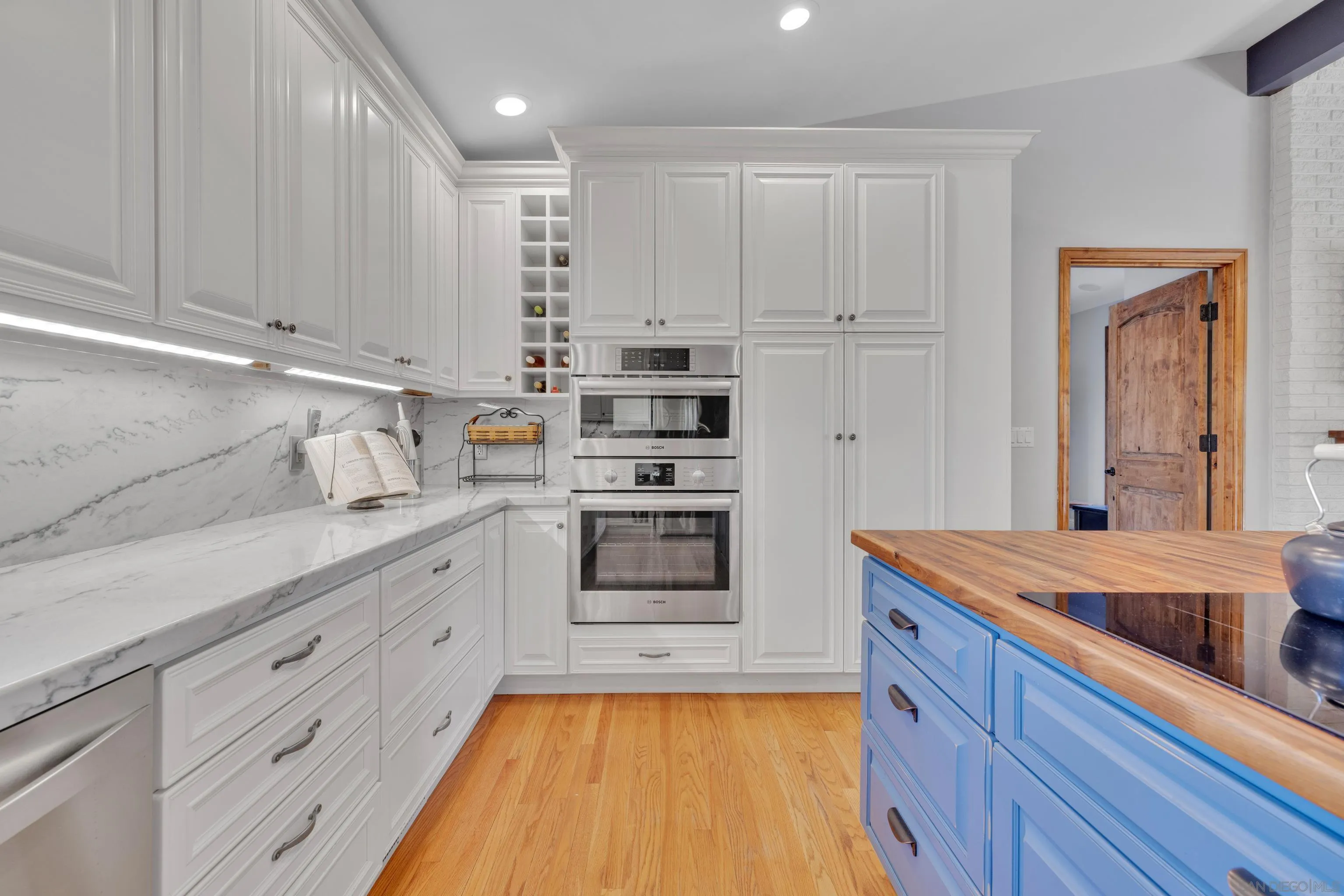 16548 Espola Road Poway, CA 92064 - Photo 9 of 70 a kitchen with stainless steel appliances granite countertop a sink a stove and cabinets