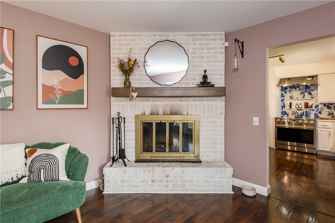 4102 Ridgetop Drive Bellbrook, OH 45305 - Photo 14 of 33 This inviting space features a charming fireplace, perfect for cozy gatherings and elegant living.