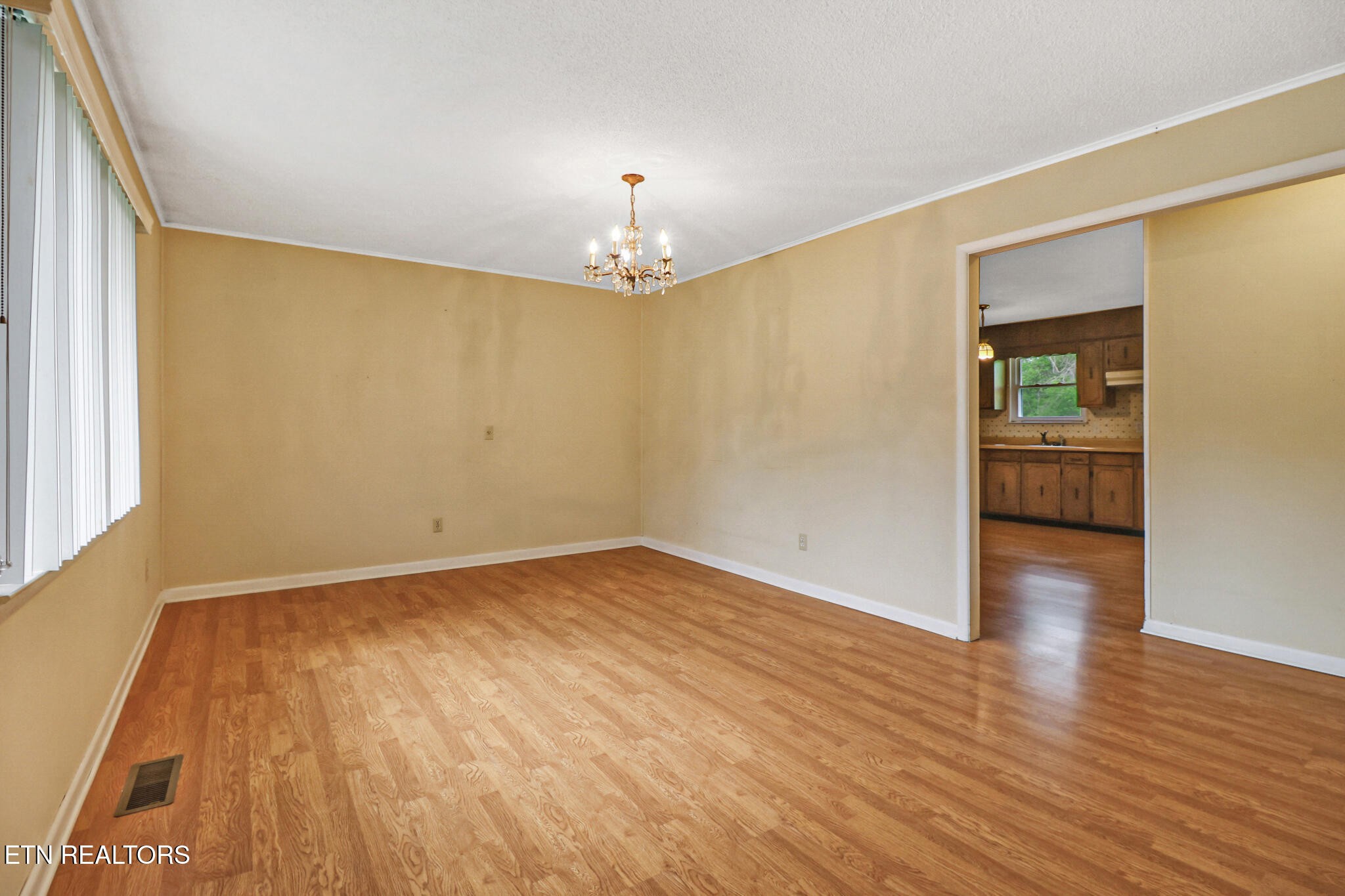 148 Porter Lane Spring City, TN 37381 - Photo 15 of 55 wooden floor in an empty room with a window