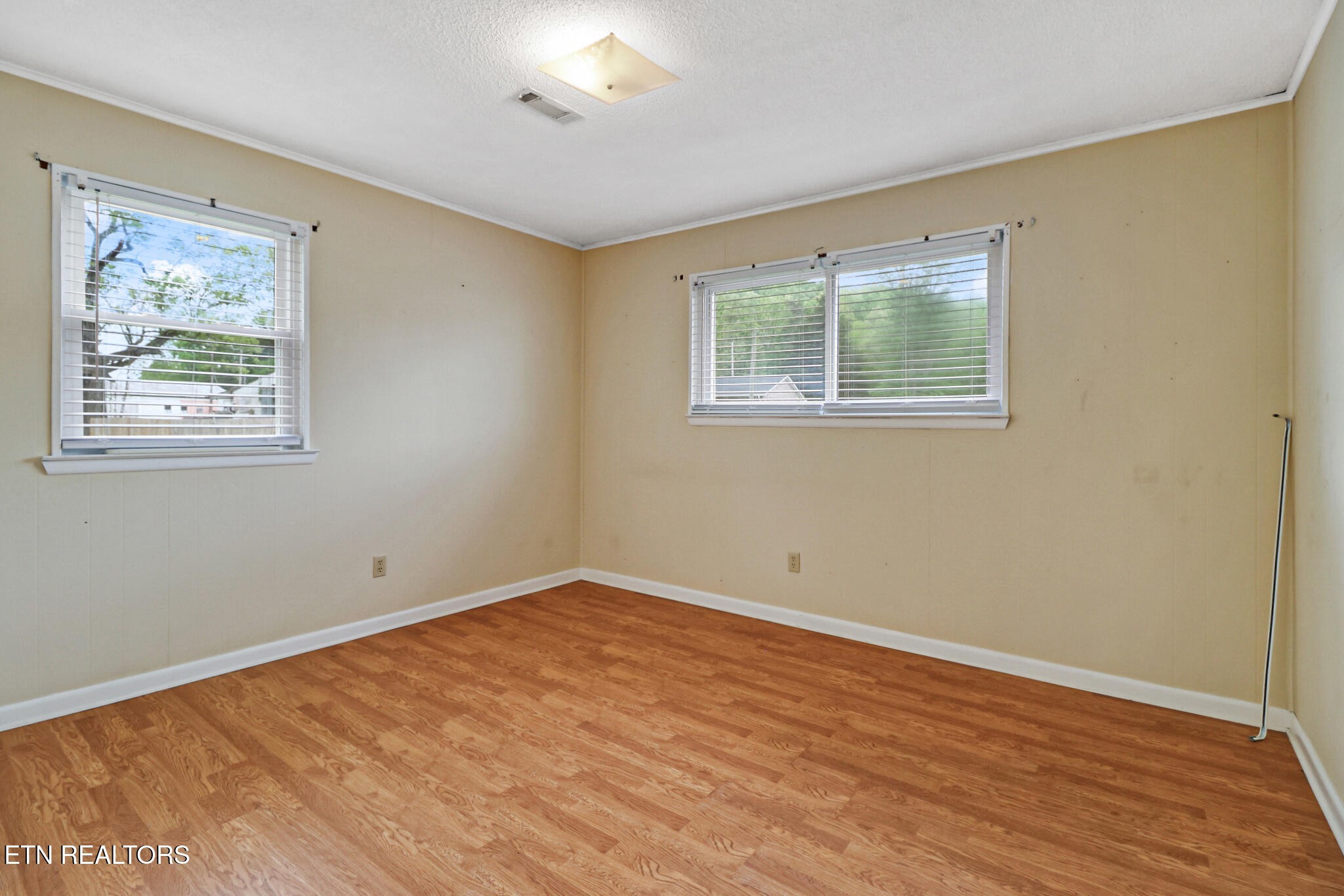 148 Porter Lane Spring City, TN 37381 - Photo 19 of 55 a view of an empty room with wooden floor and a window