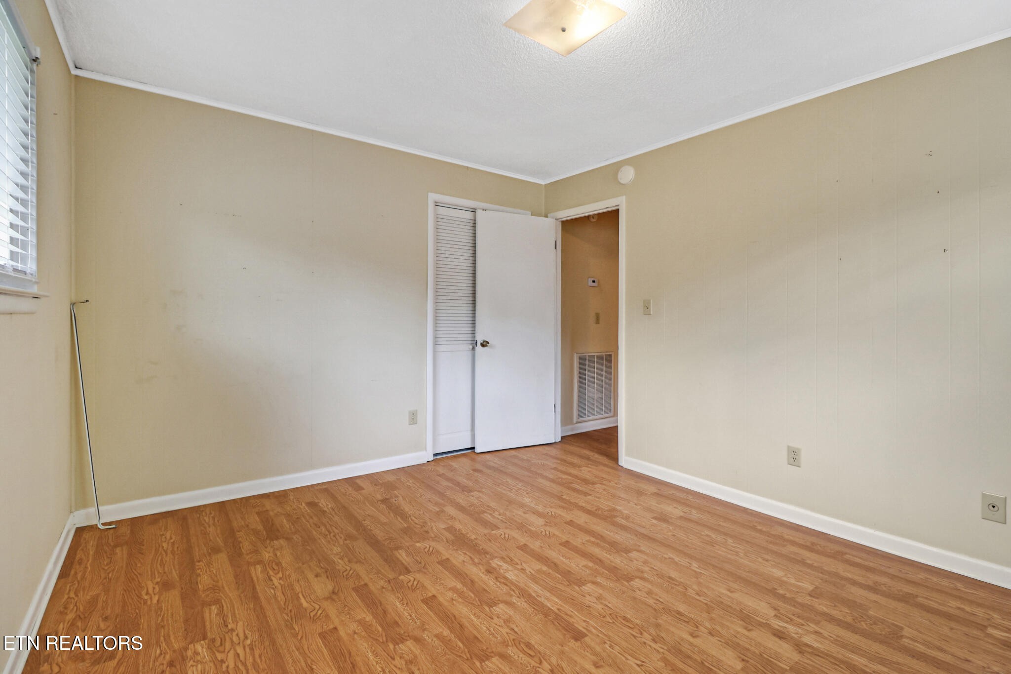 148 Porter Lane Spring City, TN 37381 - Photo 20 of 55 a view of an empty room with wooden floor