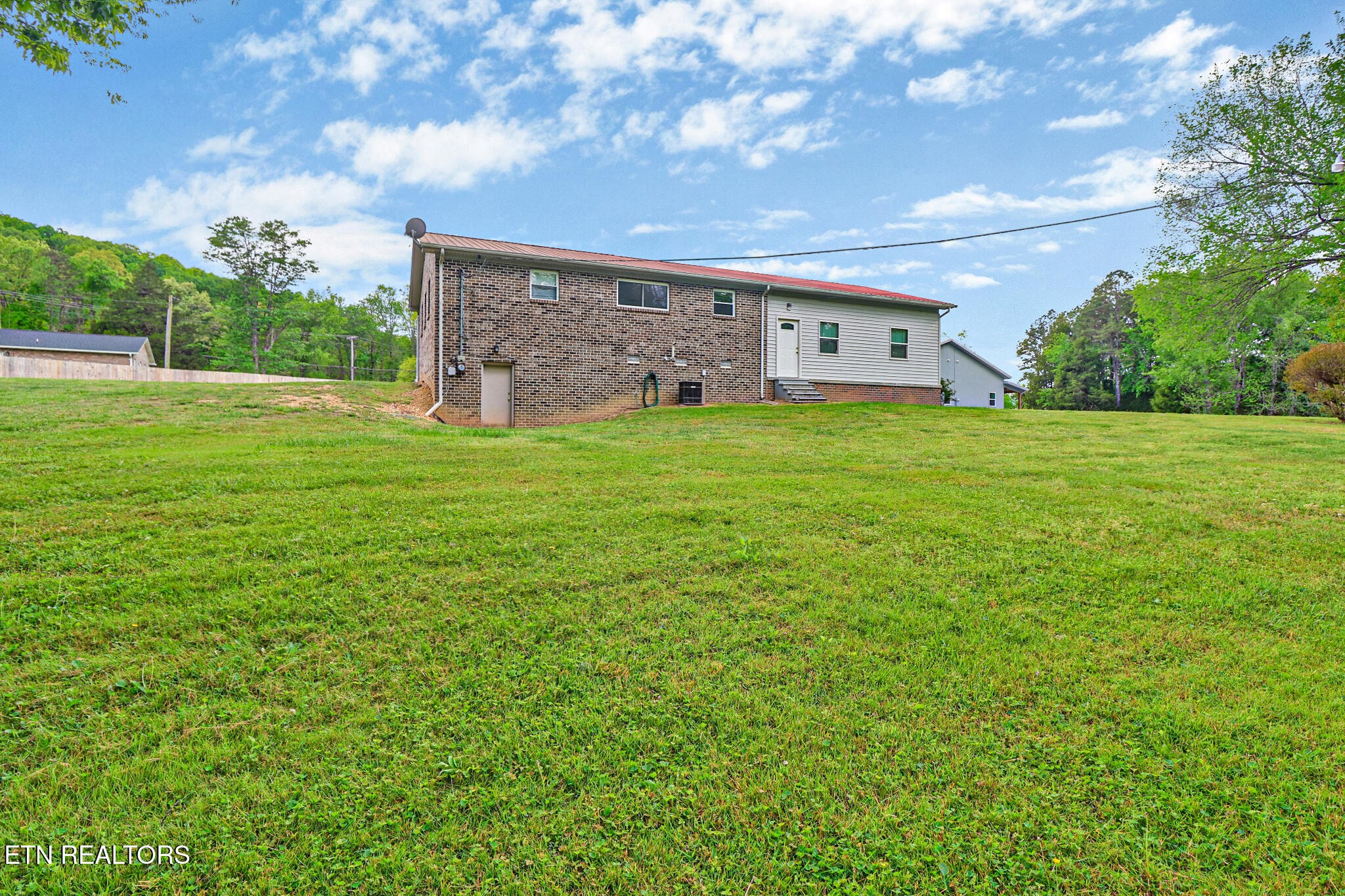 148 Porter Lane Spring City, TN 37381 - Photo 27 of 55 a front view of a house with garden