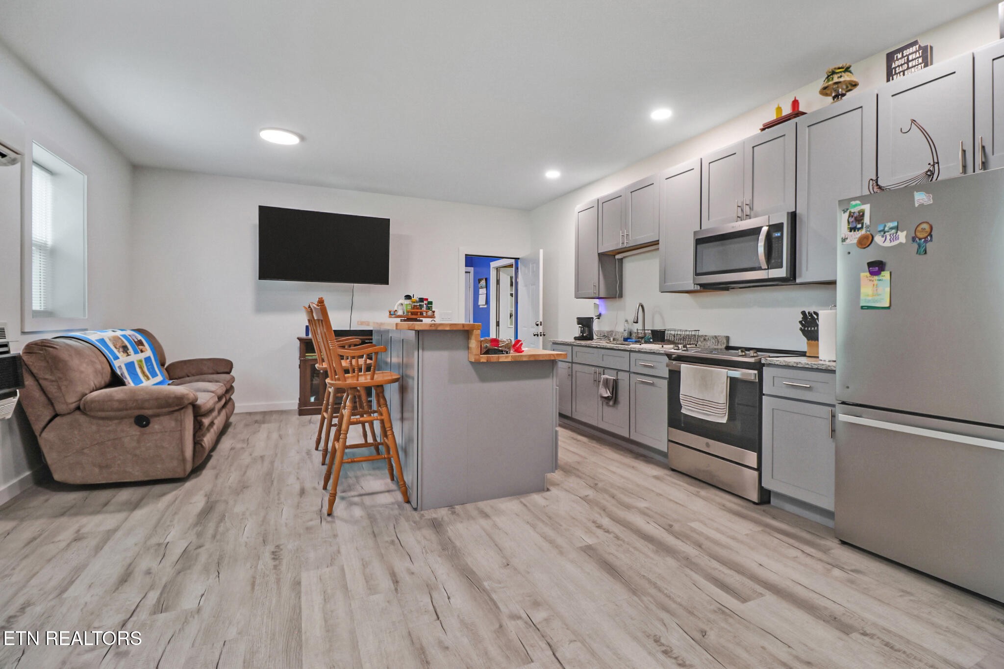 148 Porter Lane Spring City, TN 37381 - Photo 37 of 55 a living room with stainless steel appliances furniture and a flat screen tv