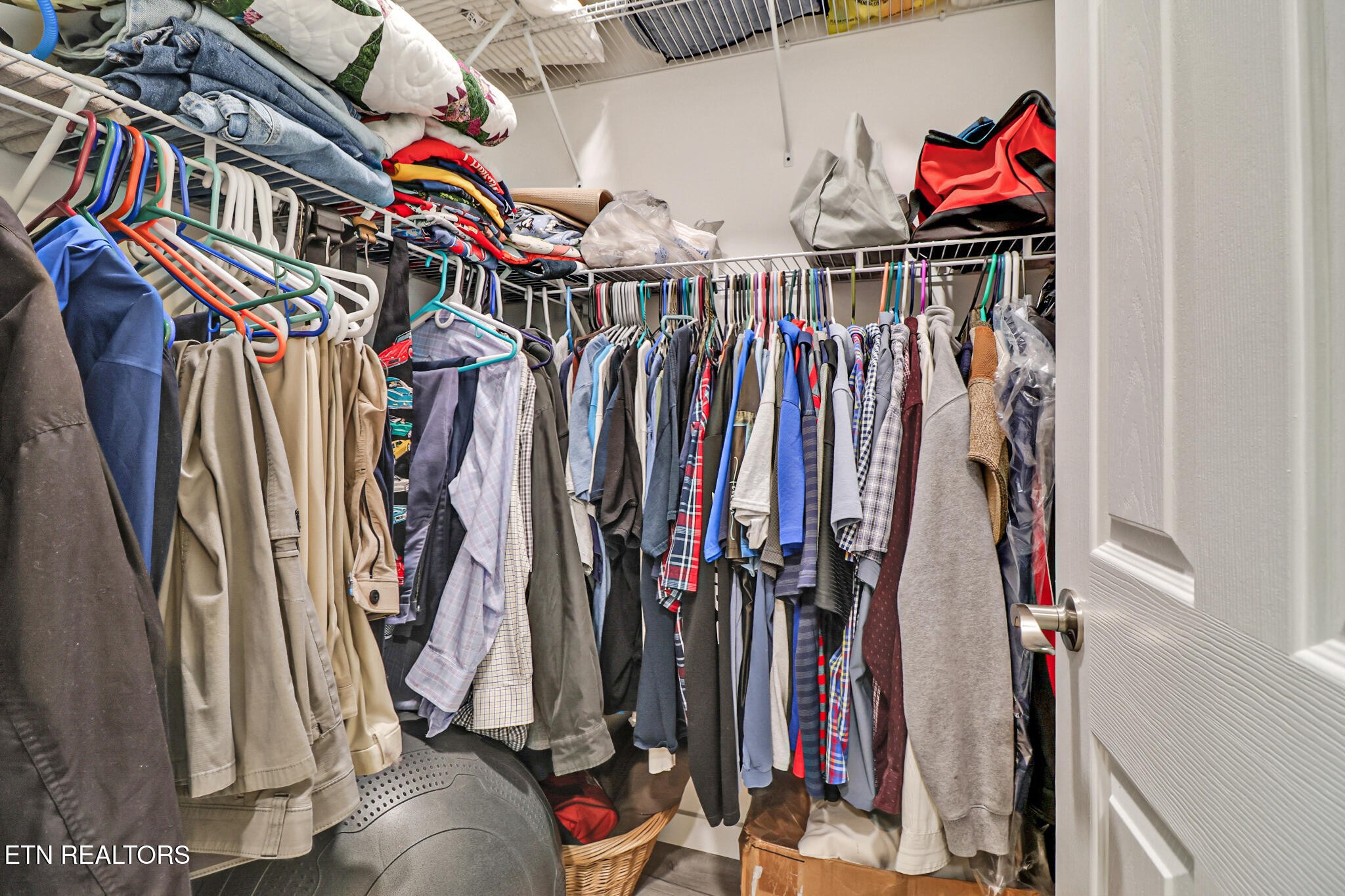 148 Porter Lane Spring City, TN 37381 - Photo 43 of 55 a view of walk in closet with clothes