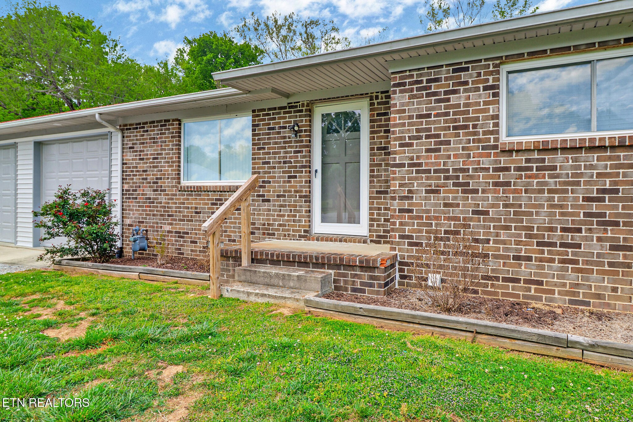 148 Porter Lane Spring City, TN 37381 - Photo 5 of 55 a front view of a house with a yard