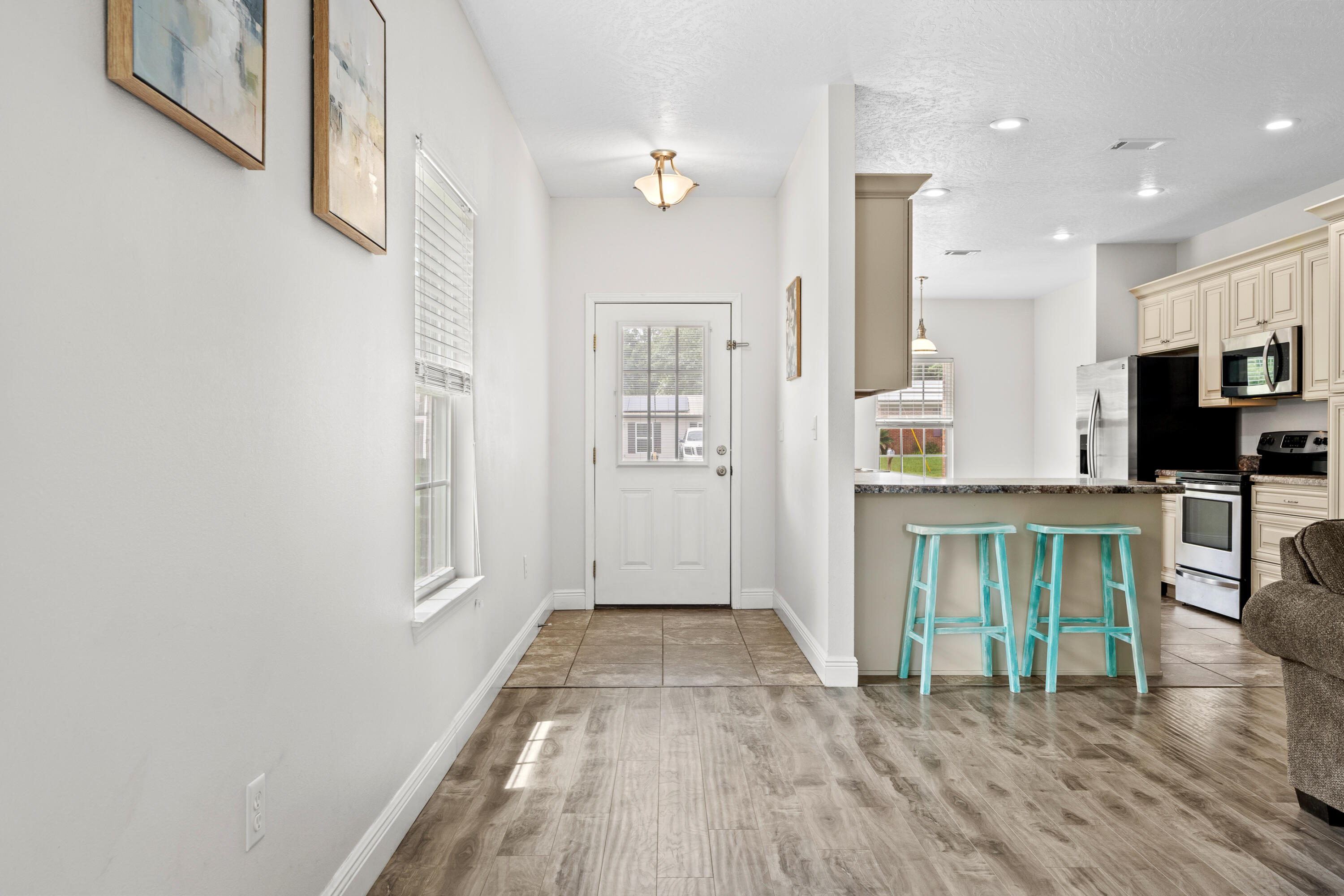 2920 Patch Avenue Crestview, FL 32539 - Photo 10 of 45 a view of kitchen with furniture and wooden floor