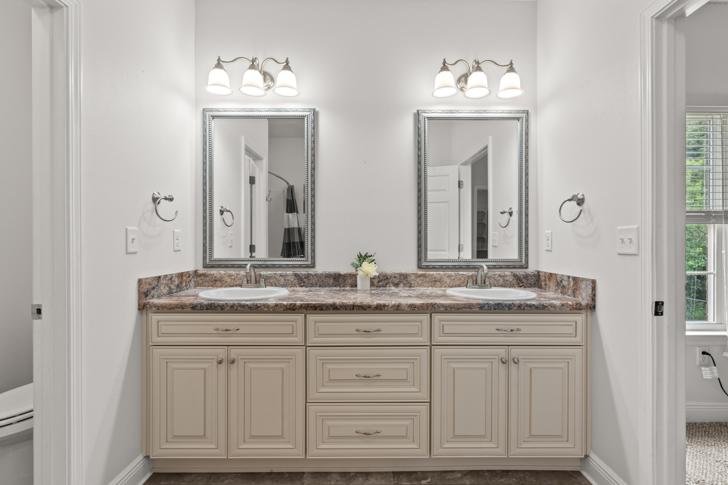 2920 Patch Avenue Crestview, FL 32539 - Photo 15 of 45 a bathroom with a granite countertop sink and a mirror