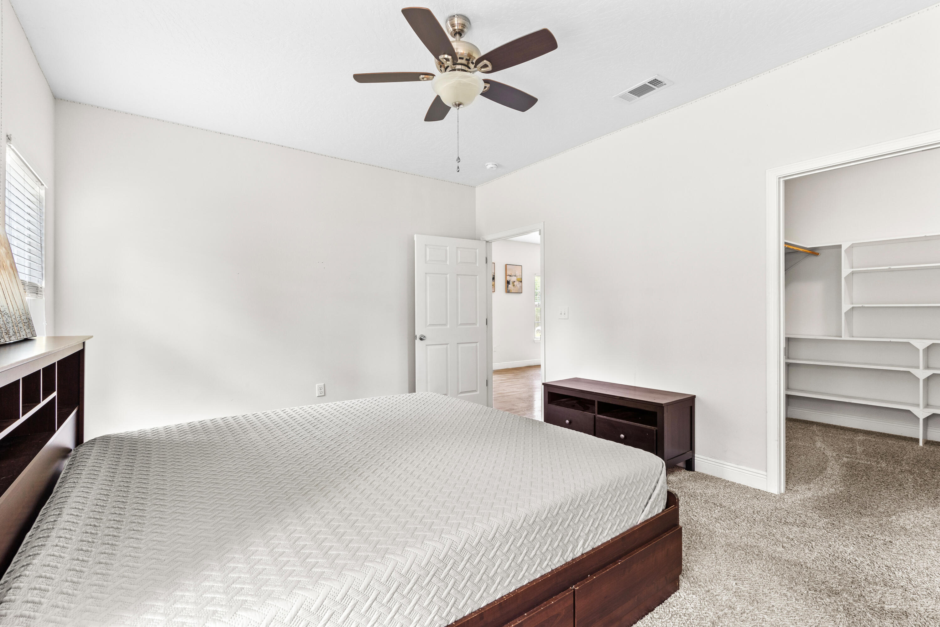 2920 Patch Avenue Crestview, FL 32539 - Photo 17 of 45 a bedroom with a bed and a ceiling fan