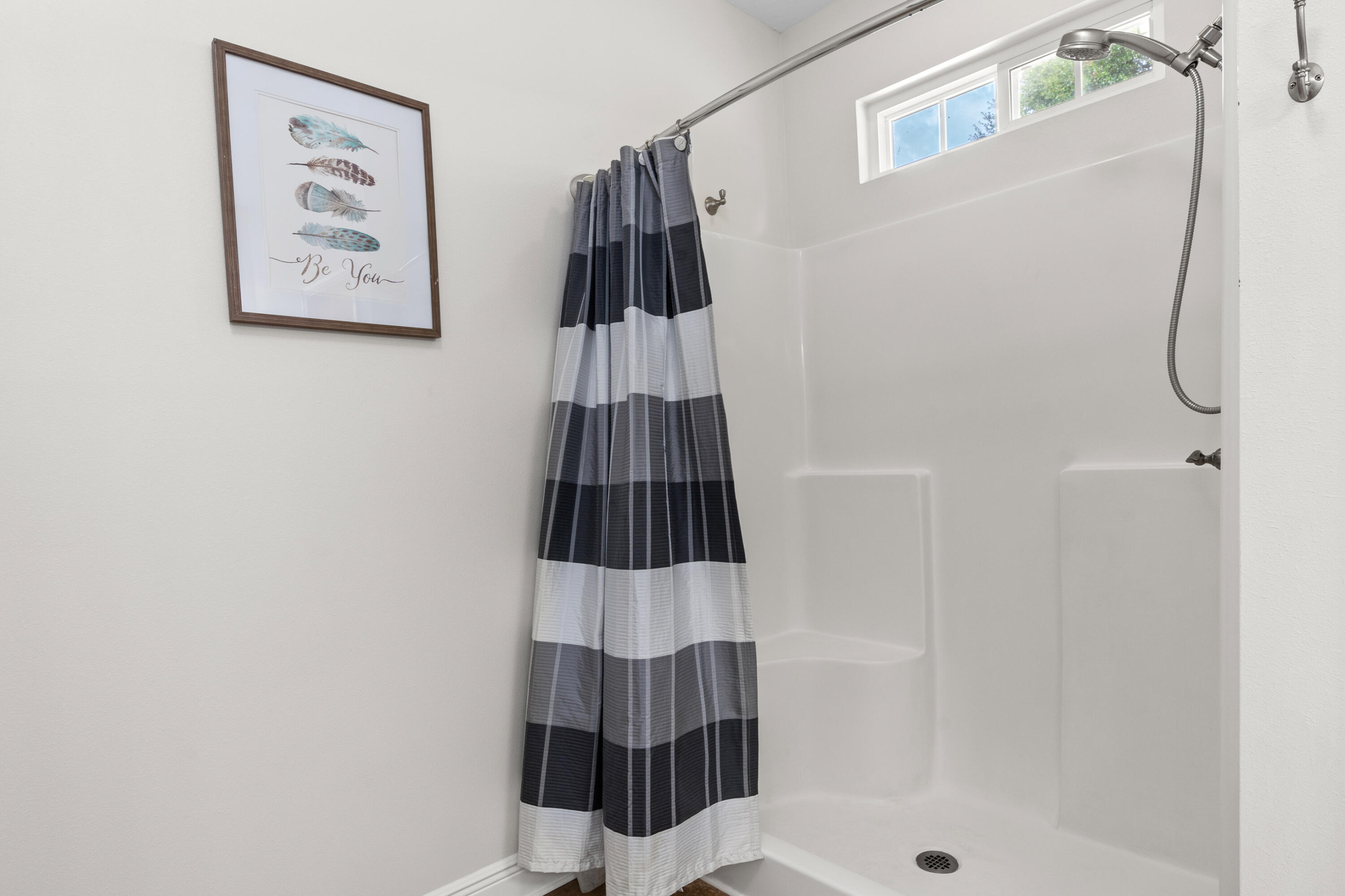 2920 Patch Avenue Crestview, FL 32539 - Photo 19 of 45 a bathroom with a shower and a window