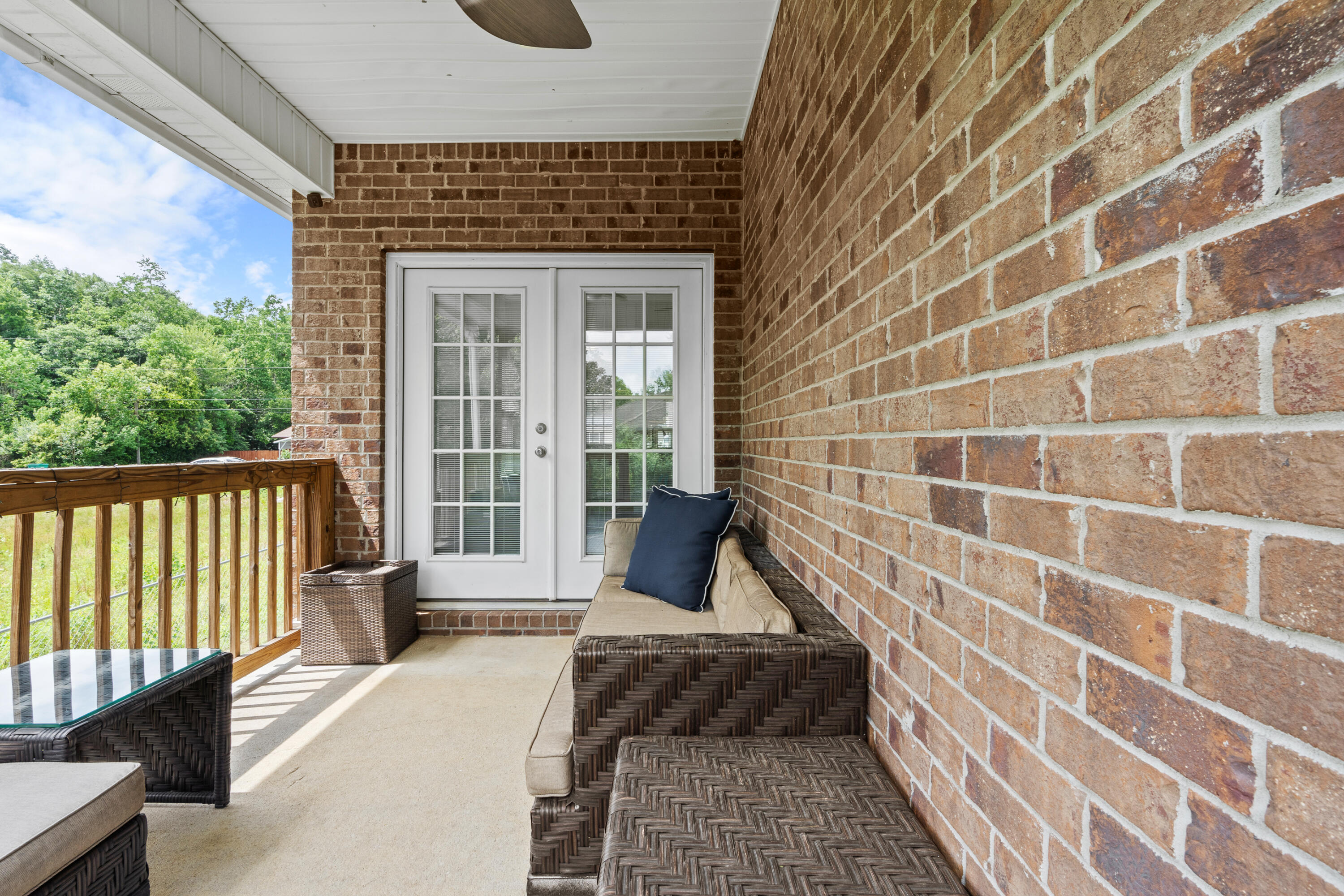 2920 Patch Avenue Crestview, FL 32539 - Photo 24 of 45 a view of a balcony with wooden floor and iron stairs