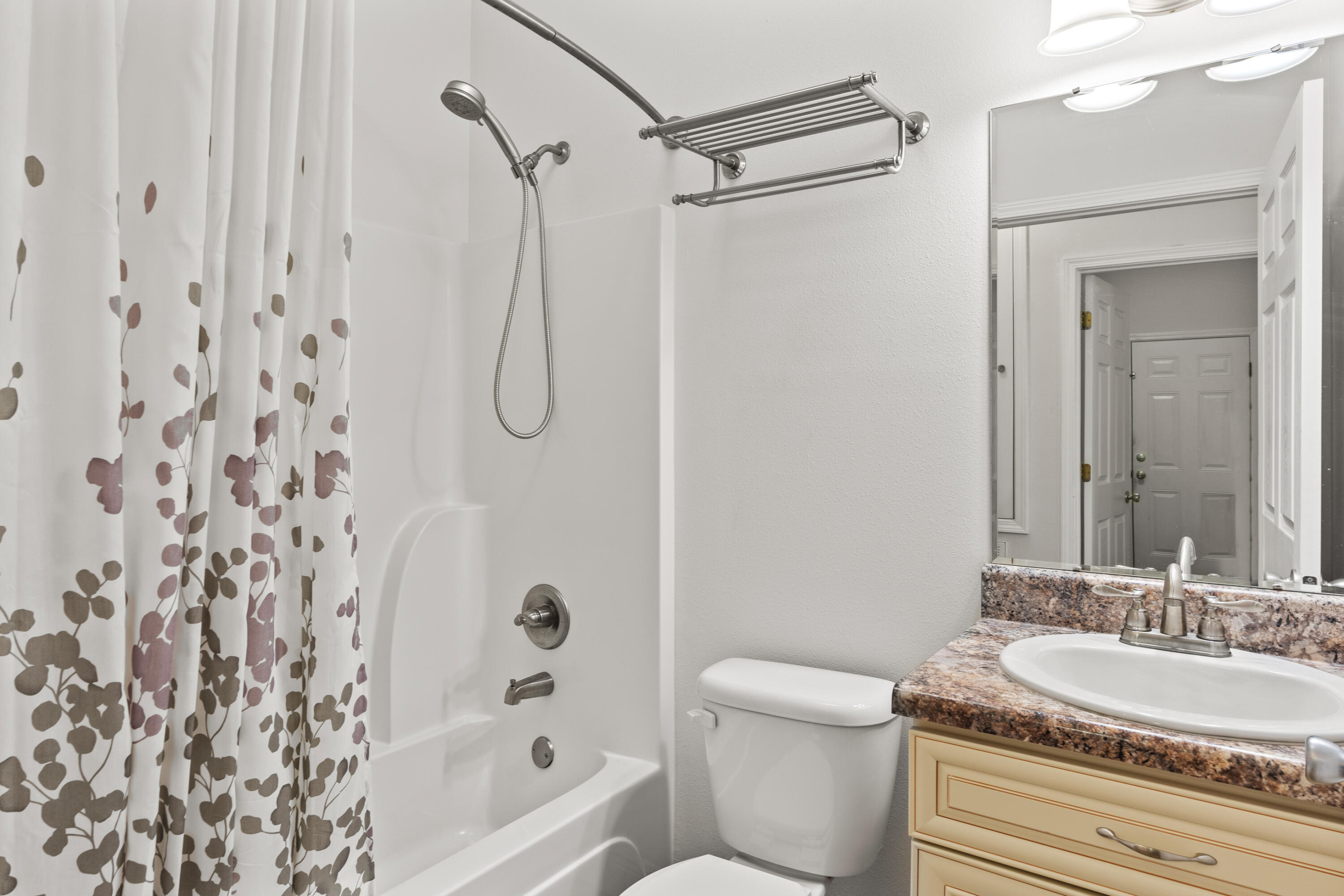 2920 Patch Avenue Crestview, FL 32539 - Photo 26 of 45 a bathroom with a granite countertop sink a toilet and a bathtub