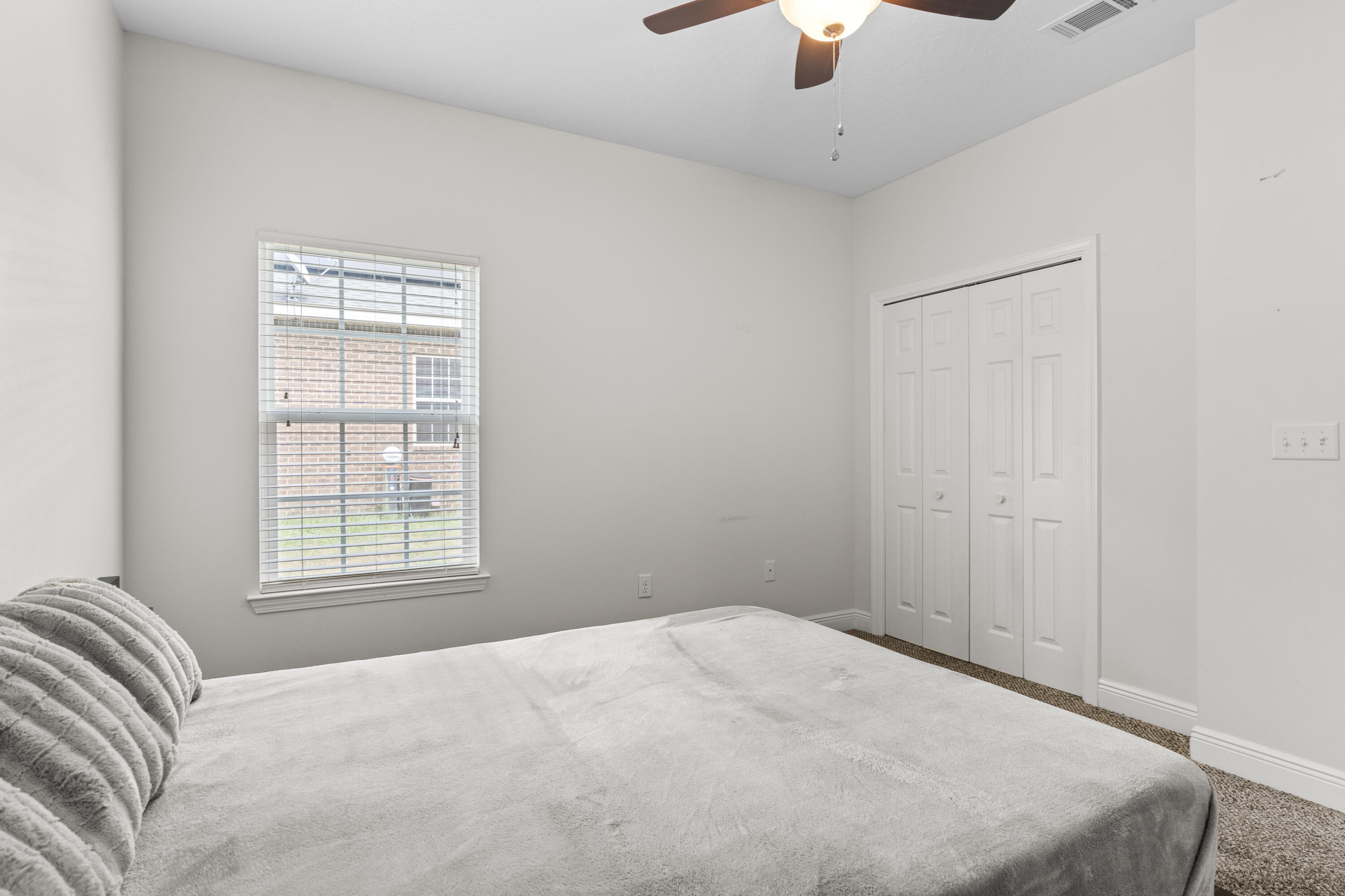 2920 Patch Avenue Crestview, FL 32539 - Photo 29 of 45 a bedroom with a bed and a window